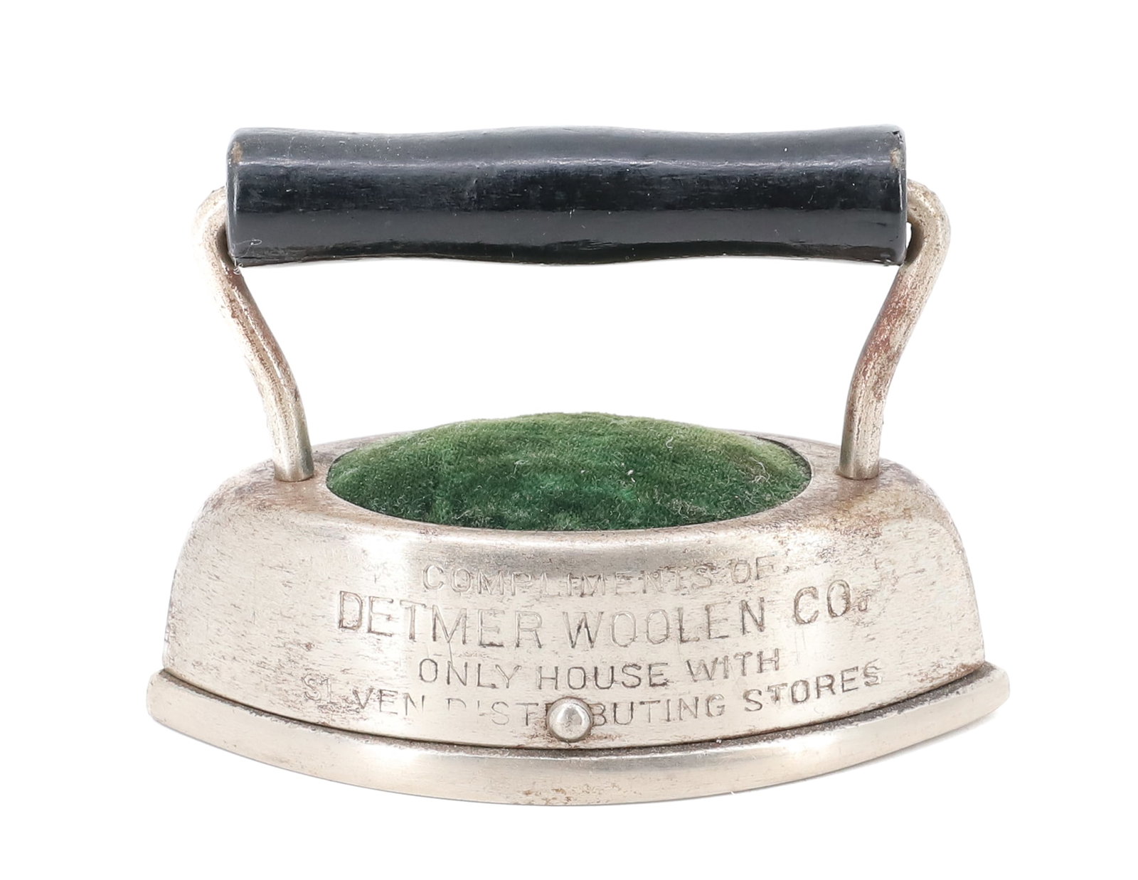 MINIATURE DOUBLE-POINT ADVERTISING IRON: PIN CUSHION DESIGN. ADVERTISING "DETMER WOOLENS CO." 4" L. PLEASE READ CAREFULLY - ITEMS MUST BE PAID FOR THROUGH LIVE AUCTIONEERS OR WITH CASH OR CHECK IN PERSON - Terms for Purchasing and Shipping