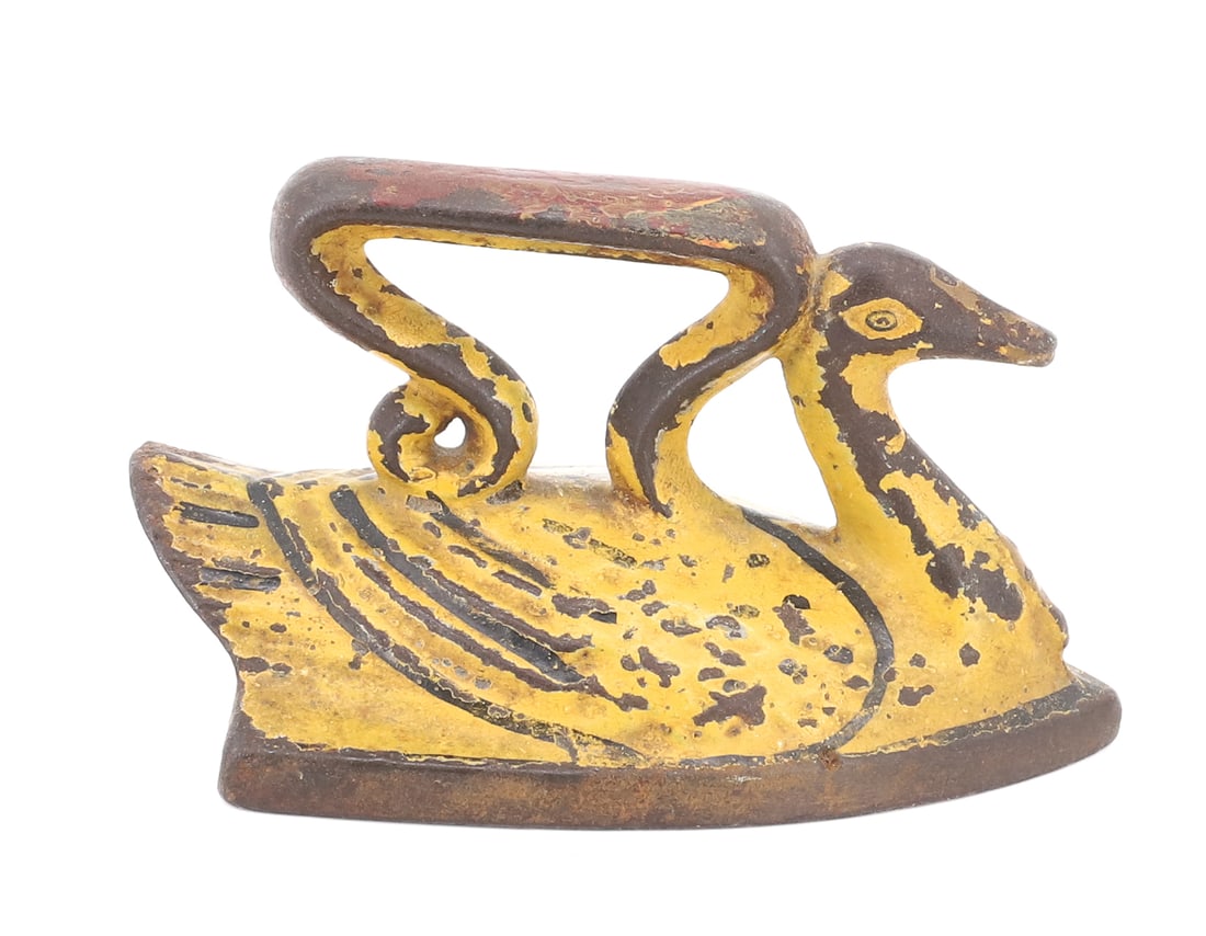 MINIATURE TOY SWAN IRON: YELLOW PAINTED BODY WITH TRACES OF RED PAINTED HANDLE. 2 3/4" L. PLEASE READ CAREFULLY - ITEMS MUST BE PAID FOR THROUGH LIVE AUCTIONEERS OR WITH CASH OR CHECK IN PERSON - Terms for Purchasing and