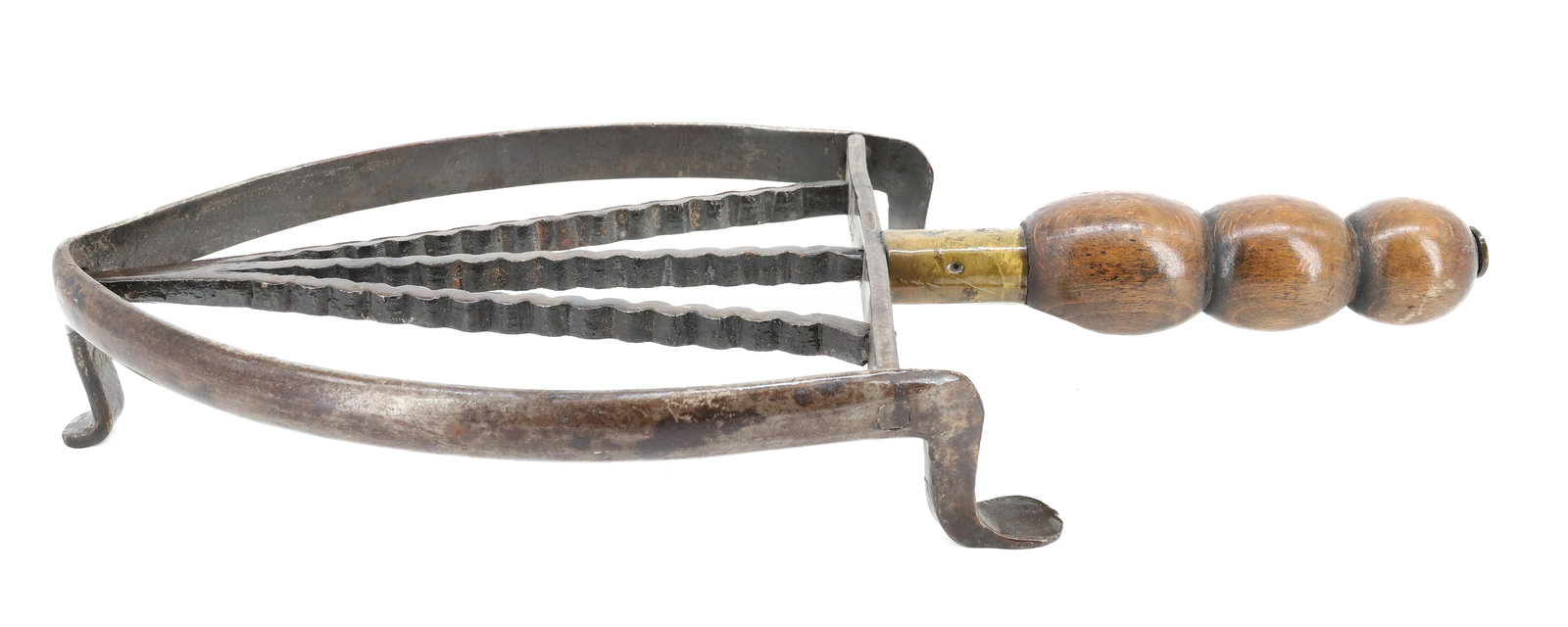 ANTIQUE TRIVET W/ WOODEN HANDLE: FOOTED TRIVET WITH WAVY LINES IN V-PATTERN. SHOE FEET. 7" X 5". PLEASE READ CAREFULLY - ITEMS MUST BE PAID FOR THROUGH LIVE AUCTIONEERS OR WITH CASH OR CHECK IN PERSON - Terms for Purchasing and