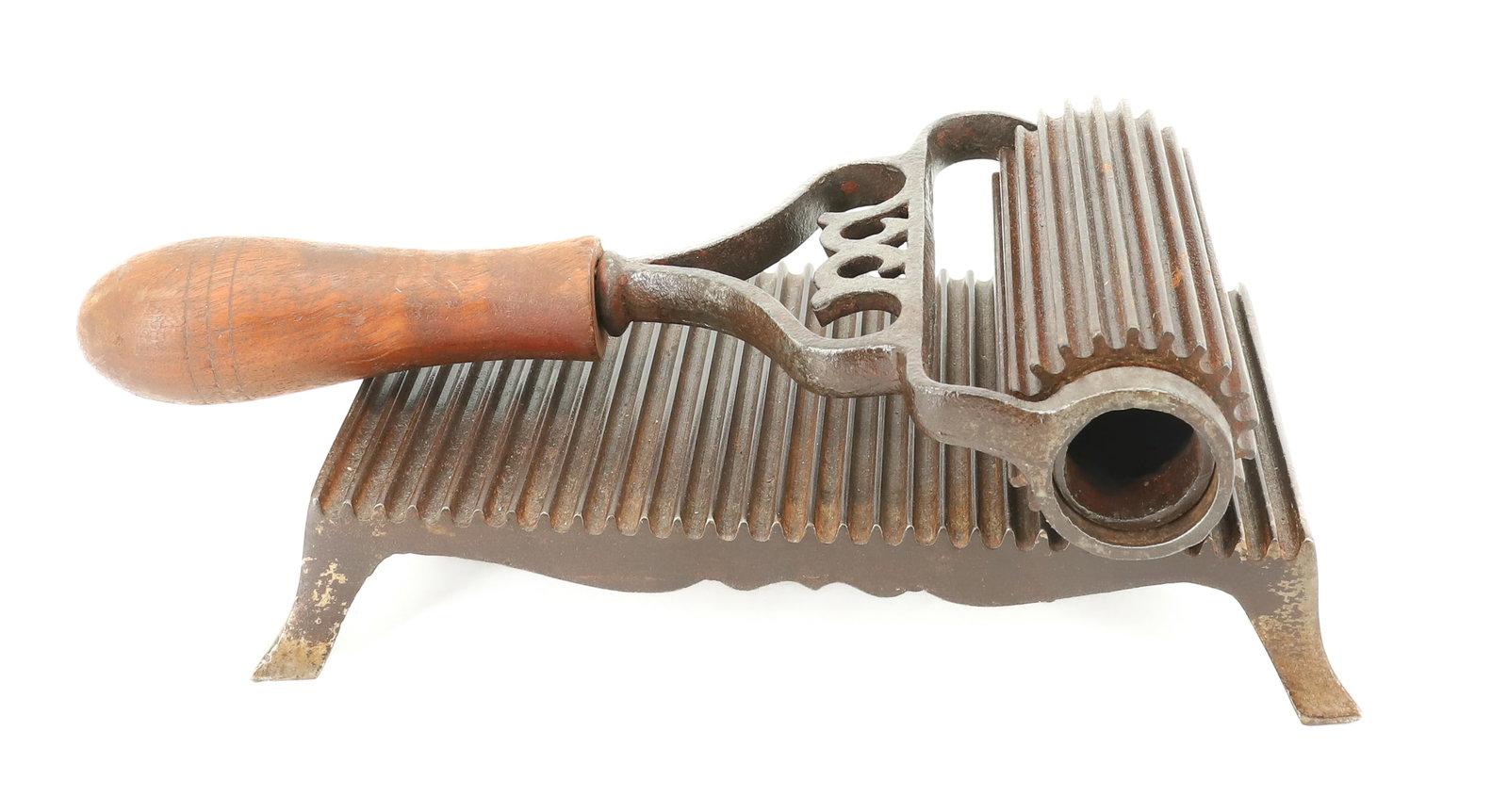 ROLLER FLUTER: CAST IRON WITH HEART SHAPED IRON WORK WITH WOODEN HAND GRIP. 7 1/2" L. PLEASE READ CAREFULLY - ITEMS MUST BE PAID FOR THROUGH LIVE AUCTIONEERS OR WITH CASH OR CHECK IN PERSON - Terms for Purchasing