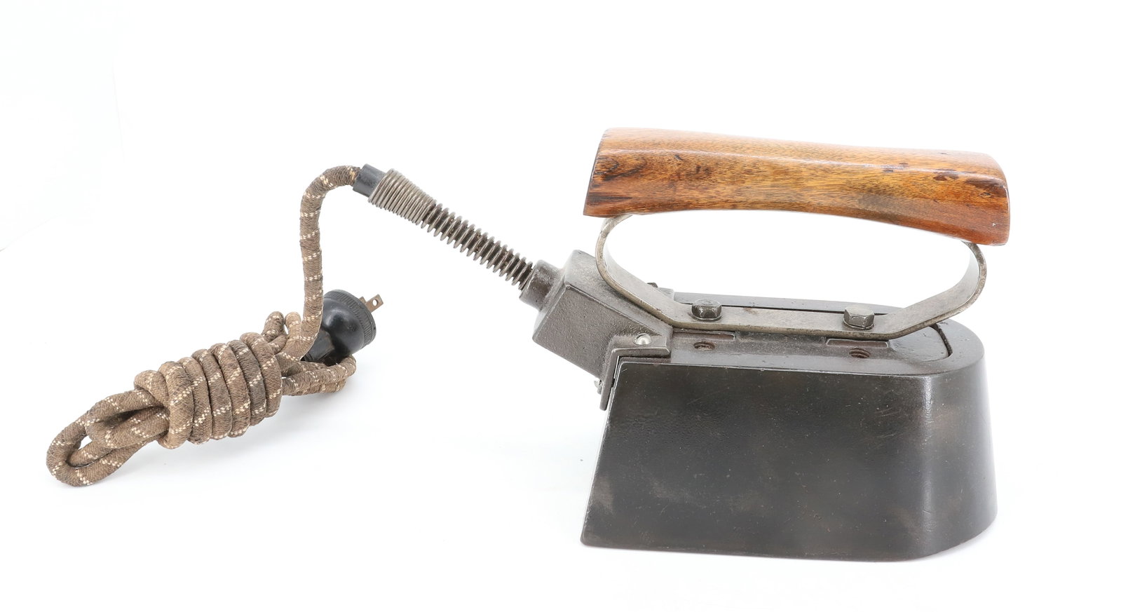 ELECTRIC HAT IRON: THICK BODY HATTER'S IRON. UNMARKED WITH WOODEN HANDLE. 7" L. PLEASE READ CAREFULLY - ITEMS MUST BE PAID FOR THROUGH LIVE AUCTIONEERS OR WITH CASH OR CHECK IN PERSON - Terms for Purchasing and Shipping