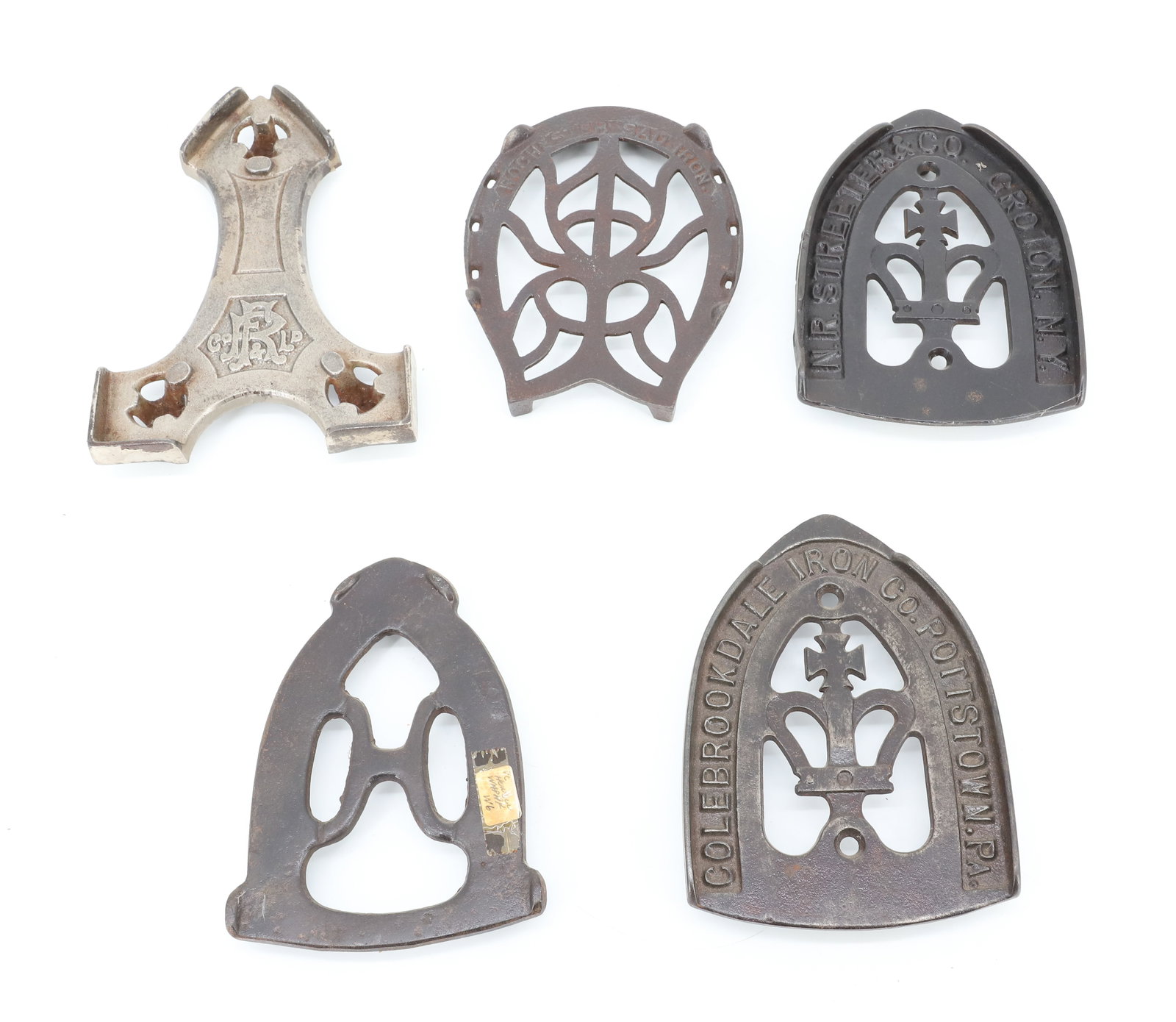 LOT OF ANTIQUE PRESSING IRON TRIVETS: (5) INCLUDING: COLEBROOKDALE IRON CO. POTTSVILLE, PA, N.R. STREETER & CO. WITH CROWN, WAPACK, ROCHESTER HORSESHOE DESIGN AND F.R. #1 TRIVET. PLEASE READ CAREFULLY - ITEMS MUST BE PAID FOR THROUGH