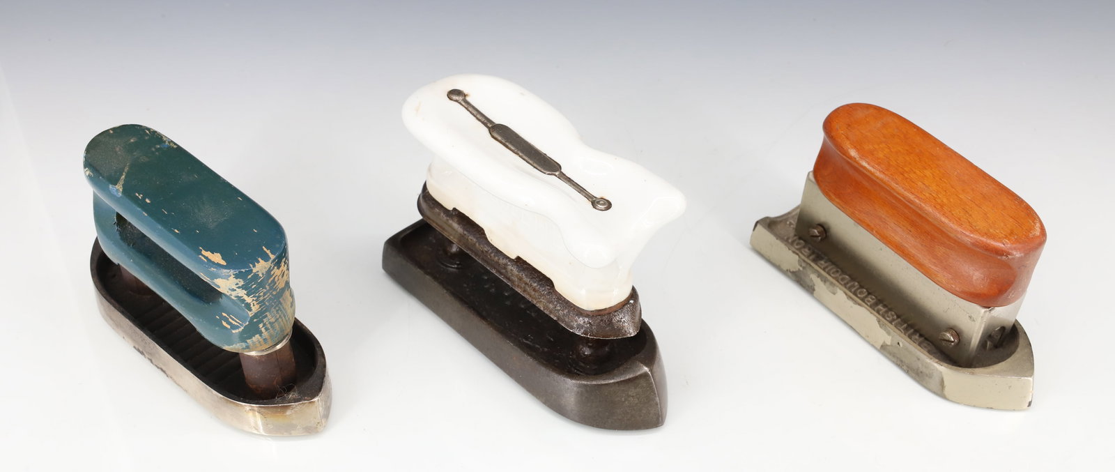 (3) META FUEL IRONS: INCLUDING: BUGOLETTE PORCELAIN TOP. (2) BRITISH BOUDOIR IRONS. 5 1/2" TO 5 3/4" LENGTHS. PLEASE READ CAREFULLY - ITEMS MUST BE PAID FOR THROUGH LIVE AUCTIONEERS OR WITH CASH OR CHECK IN PERSON -