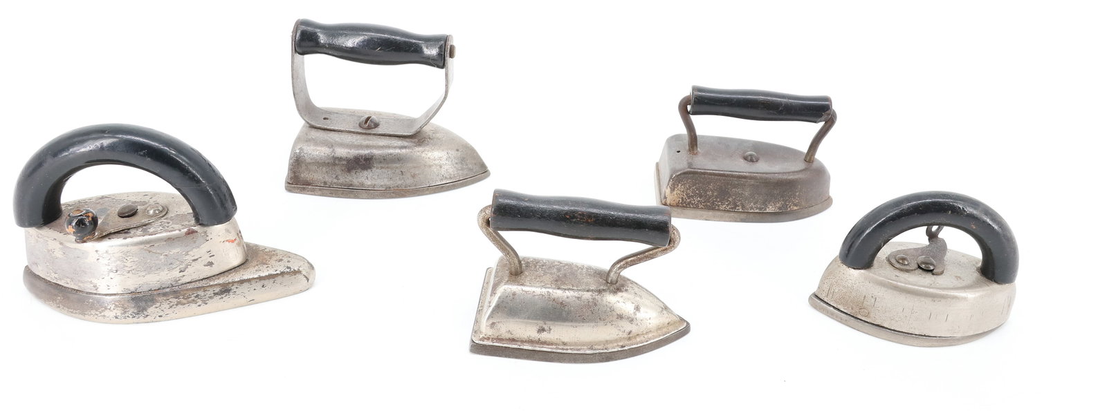 (5) ANTIQUE SMALL SIZE IRONS: INCLUDING: DOVER SLEEVE IRON. TOY FLAT IRON. MINI TOUCH-UP DOUBLE POINT. (2) SPADE INDY-STYLE IRONS. PLEASE READ CAREFULLY - ITEMS MUST BE PAID FOR THROUGH LIVE AUCTIONEERS OR WITH CASH OR CHECK IN PE