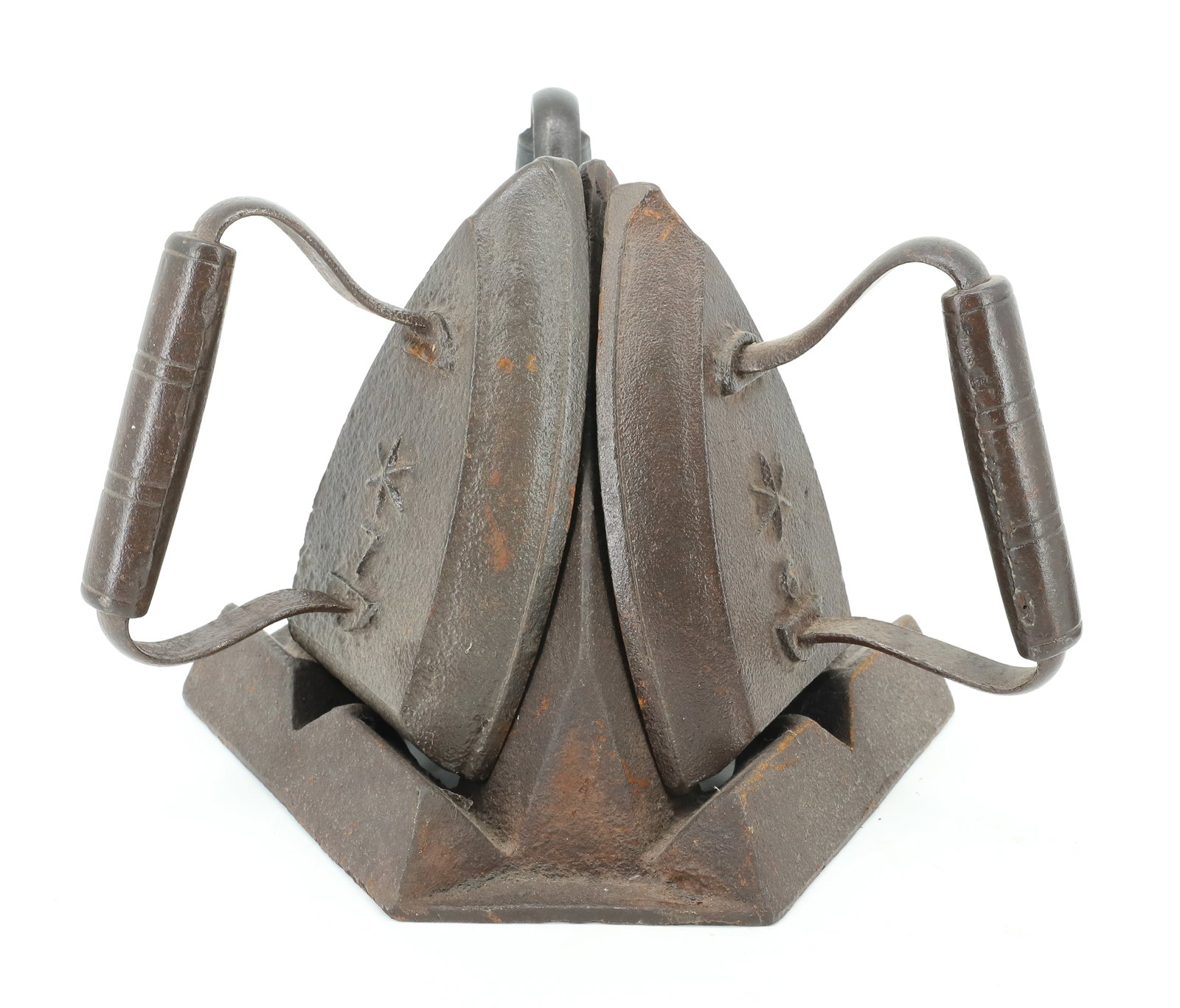 PAIR OF CAST IRON SAD IRON HEATERS: PYRAMID FORM. THREE SLOTS FOR SAD IRONS. INCLUDES THREE SAD IRONS. PLEASE READ CAREFULLY - ITEMS MUST BE PAID FOR THROUGH LIVE AUCTIONEERS OR WITH CASH OR CHECK IN PERSON - Terms for Purchasing and