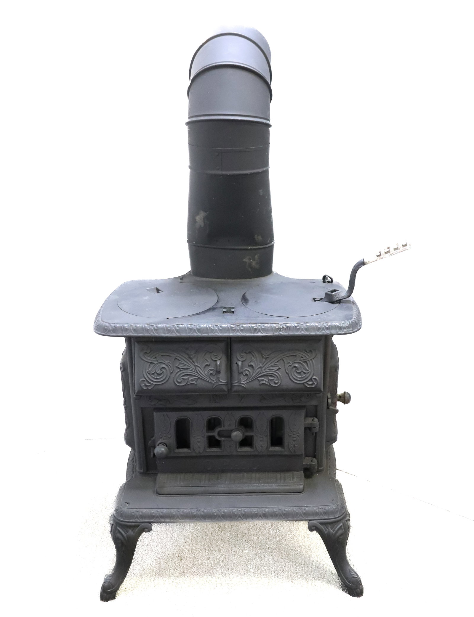 A.T. NYE & SON CAST IRON STOVE: NO. 7 EMBOSSED "OPAL" ON FRONT. MRKD. ON BACK "...MARIETTA, O. 1893" TWO BURNER. 19 1/2" X 19" X 15". CONTEMPORARY STOVE PIPE. PLEASE READ CAREFULLY - ITEMS MUST BE PAID FOR THROUGH LIVE AUCTIONEERS