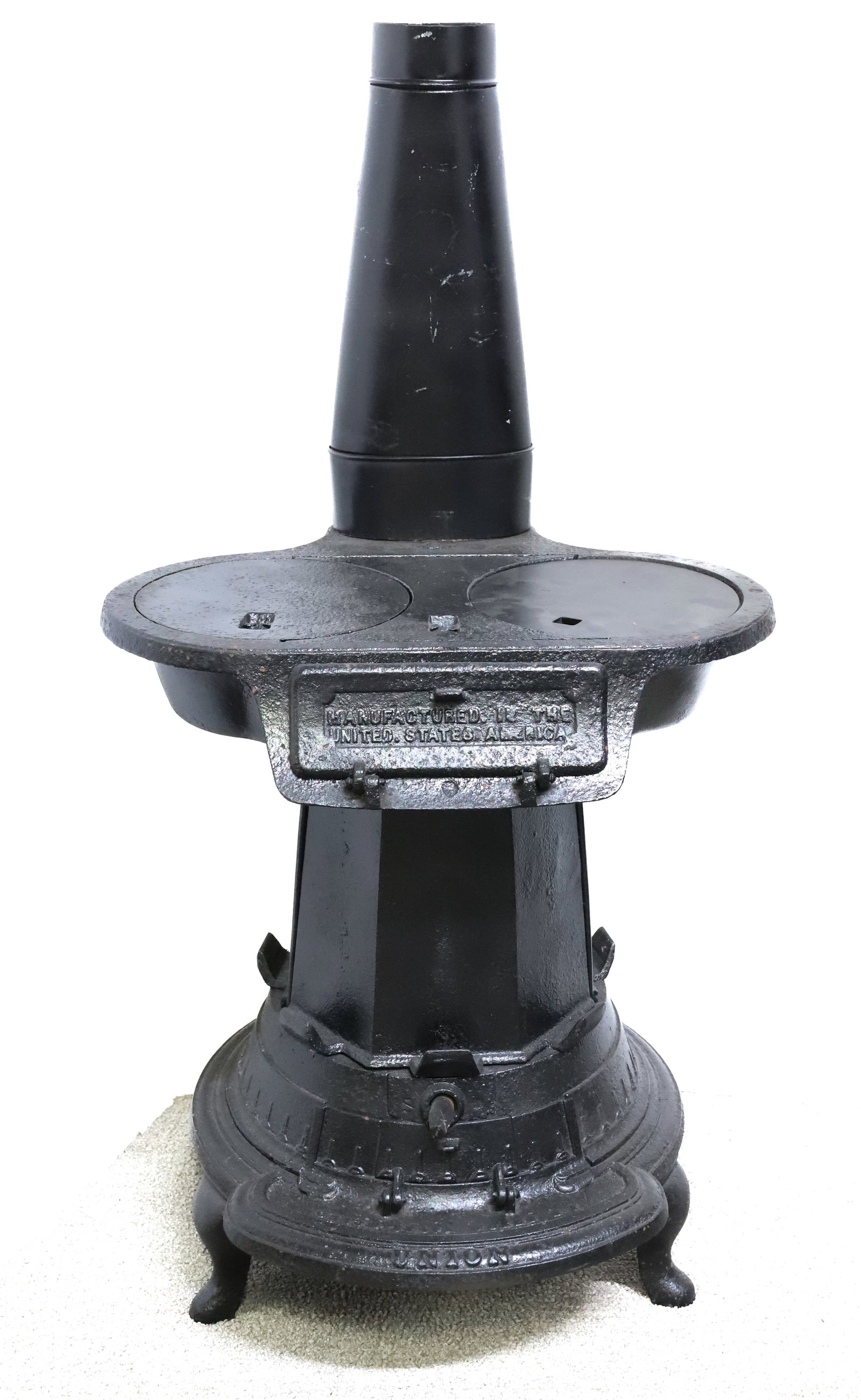 CAST IRON "UNION LAUNDRY" STOVE: MRKD. NO. 4. AND "MANUFACTURED IN THE UNITED STATES OF AMERICA". HOLDS EIGHT SAD IRONS ON EXTERIOR. TWO BURNER. 23 1/4" X 20 1/2" X 18". PLEASE READ CAREFULLY - ITEMS MUST BE PAID FOR THROUGH LIVE