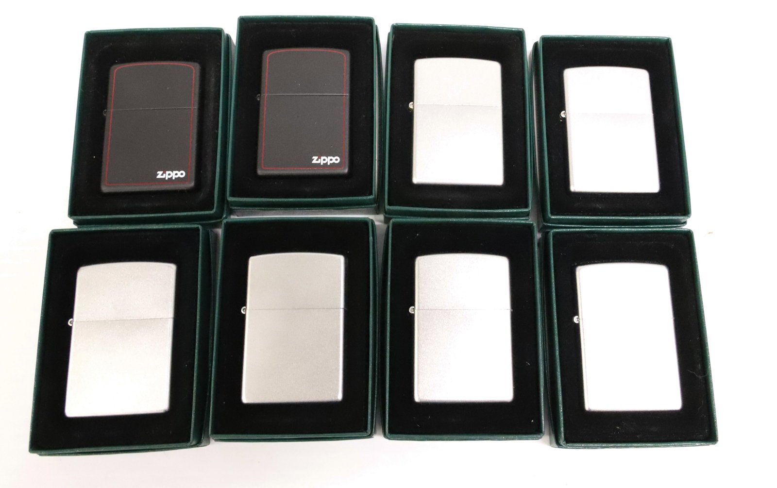 (8) Zippo Lighters, New in Boxes: Brushed Metal and Black. PLEASE READ CAREFULLY - ITEMS MUST BE PAID FOR THROUGH LIVE AUCTIONEERS OR WITH CASH OR CHECK IN PERSON - Terms for Purchasing and Shipping of Auction Items. Please read caref