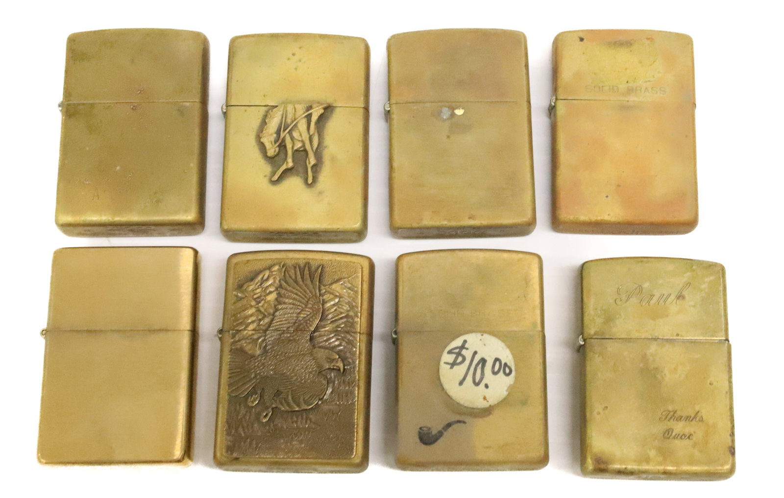 (8) Brass Zippo Lighters: Brushed Brass. Some with Engraving or applied Decoration. PLEASE READ CAREFULLY - ITEMS MUST BE PAID FOR THROUGH LIVE AUCTIONEERS OR WITH CASH OR CHECK IN PERSON - Terms for Purchasing and Shipping
