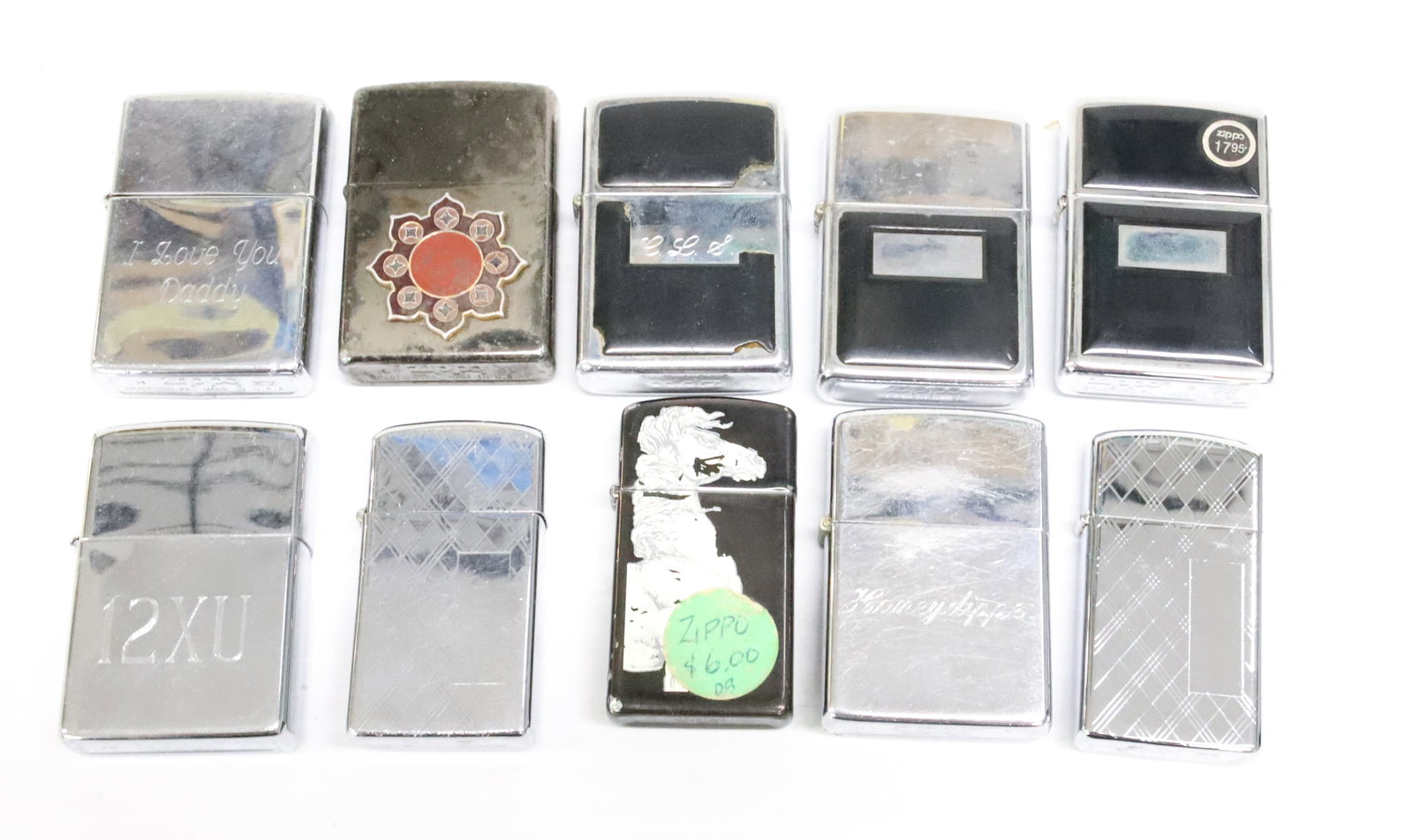 (10) Zippo Lighters: Silver with various engravings or decorations. PLEASE READ CAREFULLY - ITEMS MUST BE PAID FOR THROUGH LIVE AUCTIONEERS OR WITH CASH OR CHECK IN PERSON - Terms for Purchasing and Shipping of Auction It