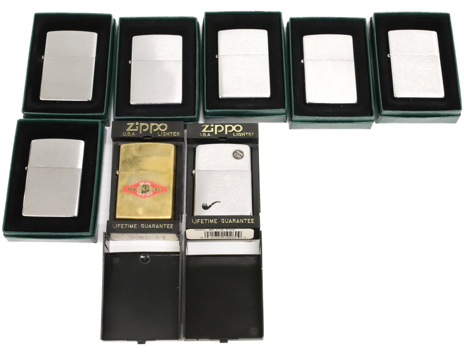 (8) Zippo Lighters New in Box: Seven Brushed Metal Finish. One Goldtone "Red Lion King of Cigars". PLEASE READ CAREFULLY - ITEMS MUST BE PAID FOR THROUGH LIVE AUCTIONEERS OR WITH CASH OR CHECK IN PERSON - Terms for Purchasing and S