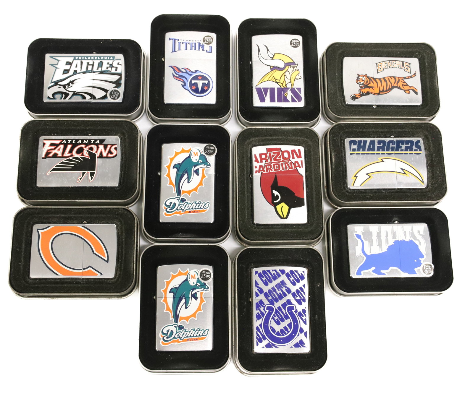 (12) Football Team Zippo Lighters: NFL Lighters In metal lid boxes. PLEASE READ CAREFULLY - ITEMS MUST BE PAID FOR THROUGH LIVE AUCTIONEERS OR WITH CASH OR CHECK IN PERSON - Terms for Purchasing and Shipping of Auction Items. Please re