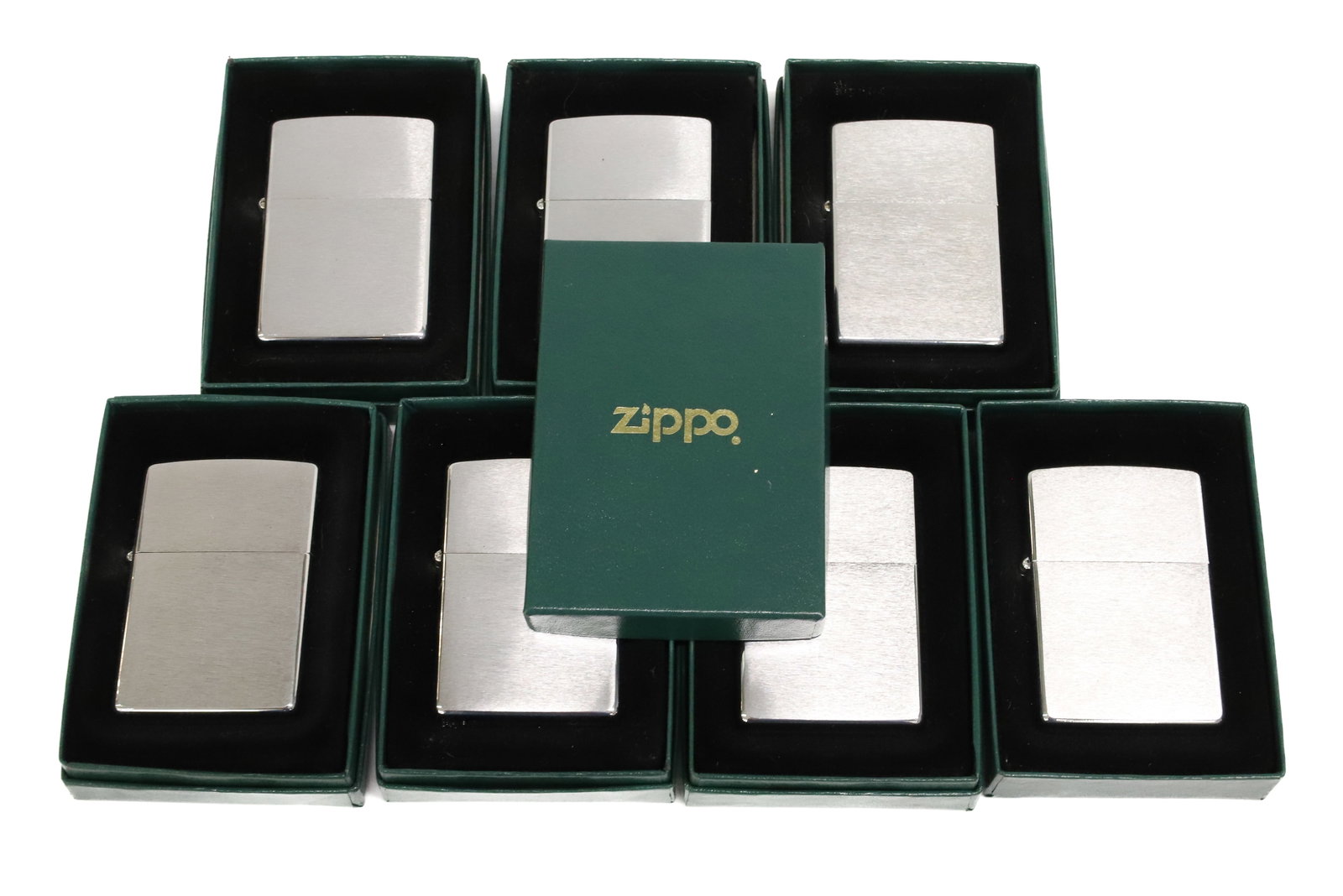 (7) Zippo Lighters, New in Box: Brushed Metal Finish. PLEASE READ CAREFULLY - ITEMS MUST BE PAID FOR THROUGH LIVE AUCTIONEERS OR WITH CASH OR CHECK IN PERSON - Terms for Purchasing and Shipping of Auction Items. Please read carefull