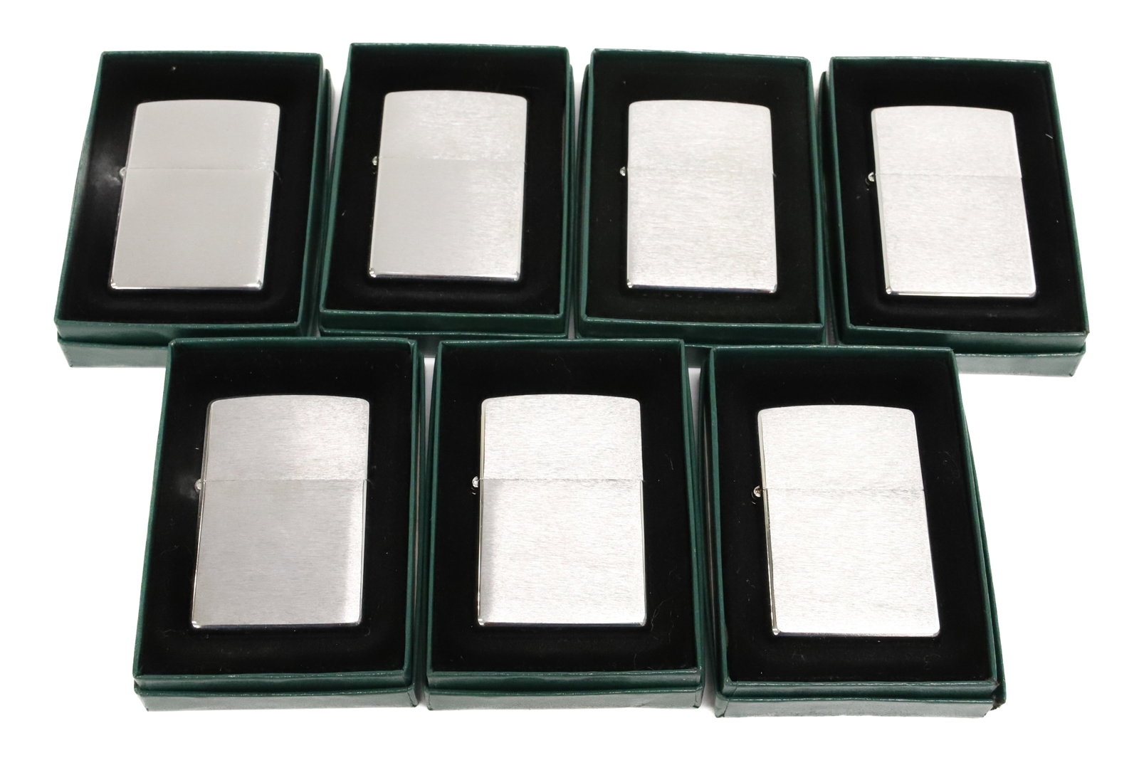(7) Zippo Lighters, New in Box: Brushed Metal Finish. PLEASE READ CAREFULLY - ITEMS MUST BE PAID FOR THROUGH LIVE AUCTIONEERS OR WITH CASH OR CHECK IN PERSON - Terms for Purchasing and Shipping of Auction Items. Please read carefull