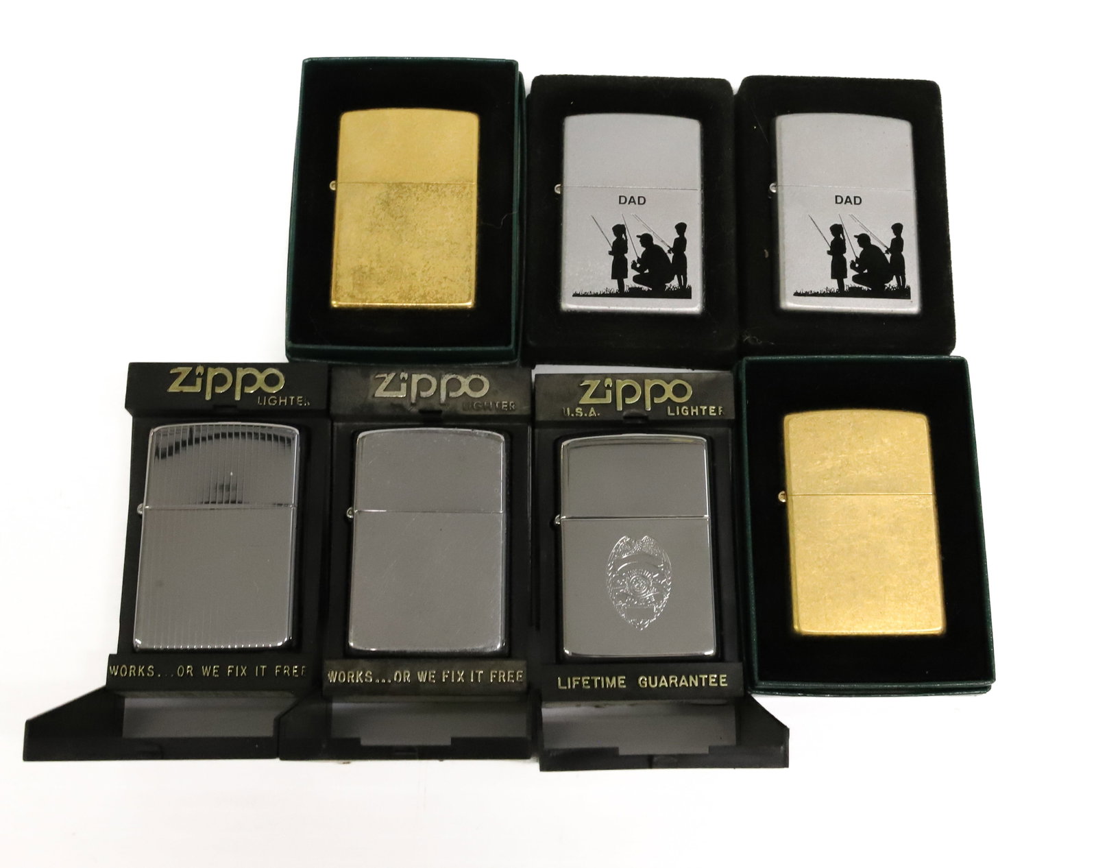 (7) Zippo Lighters, New in Box: Chrome, Brushed and Gold-tone Finishes. Original Boxes. PLEASE READ CAREFULLY - ITEMS MUST BE PAID FOR THROUGH LIVE AUCTIONEERS OR WITH CASH OR CHECK IN PERSON - Terms for Purchasing and Shipping of