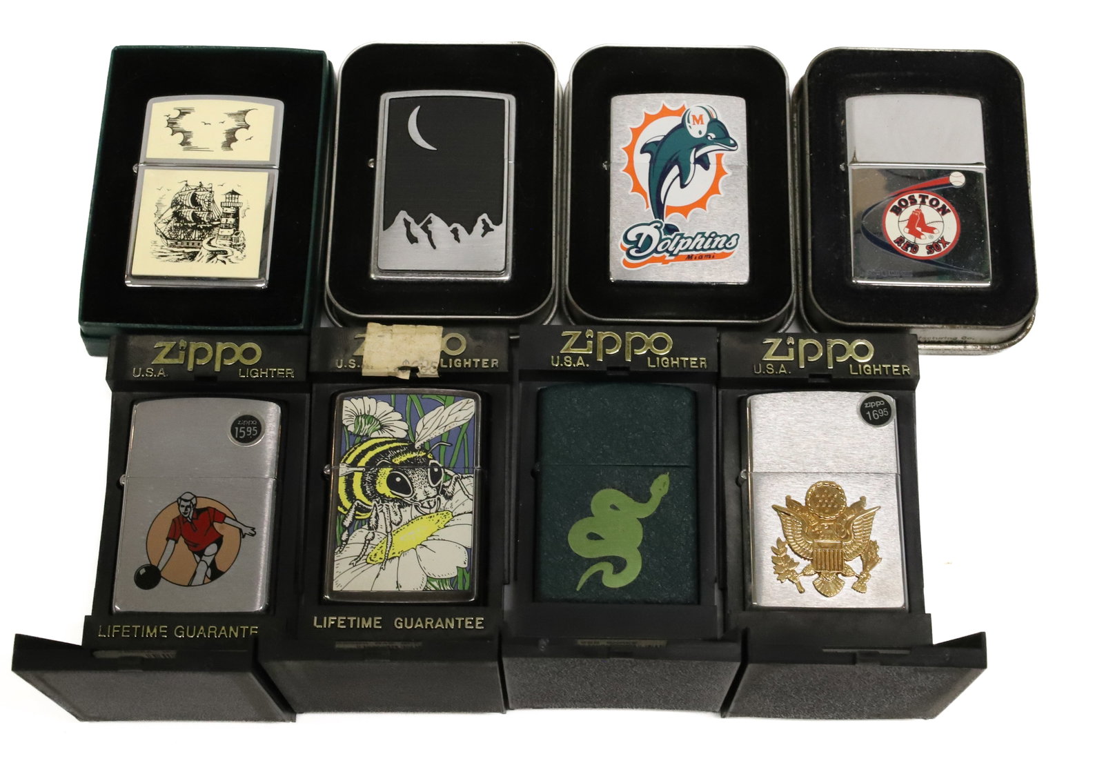 (8) Zippo Lighters New in Box: Variety of Finishes and Decorative Styles. PLEASE READ CAREFULLY - ITEMS MUST BE PAID FOR THROUGH LIVE AUCTIONEERS OR WITH CASH OR CHECK IN PERSON - Terms for Purchasing and Shipping of Auction
