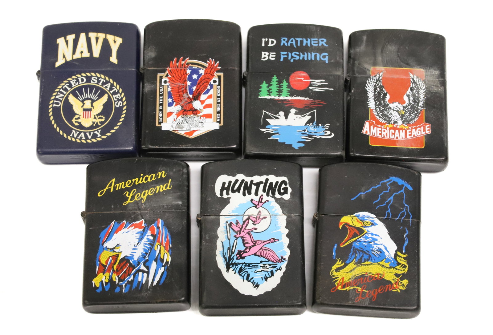 (7) Lighters with Decals: One Zippo (Navy). others are Korea. PLEASE READ CAREFULLY - ITEMS MUST BE PAID FOR THROUGH LIVE AUCTIONEERS OR WITH CASH OR CHECK IN PERSON - Terms for Purchasing and Shipping of Auction Items.
