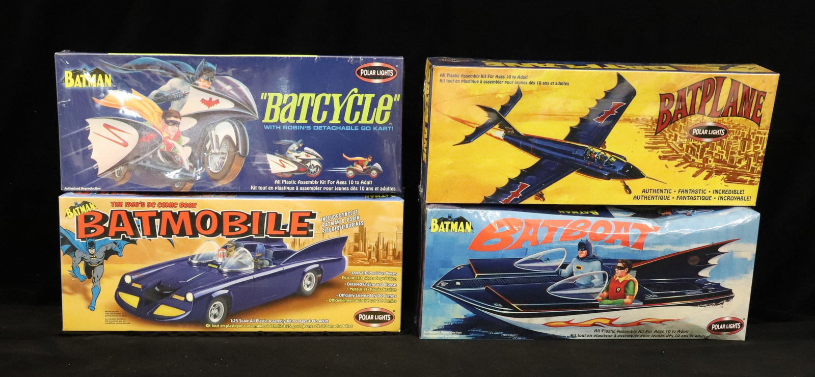 Lot of Batman Models: (4) including: Batplane, Batboat, Batcycle and 1960s style Batmobile. All sealed in plastic. PLEASE READ CAREFULLY - ITEMS MUST BE PAID FOR THROUGH LIVE AUCTIONEERS OR WITH CASH OR CHECK IN PERSON - T