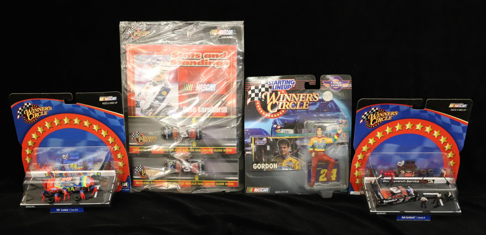 Lot of NASCAR Winner's Circle Items: Including: Jeff Gordon and Dale Earnhardt. Original Packaging. PLEASE READ CAREFULLY - ITEMS MUST BE PAID FOR THROUGH LIVE AUCTIONEERS OR WITH CASH OR CHECK IN PERSON - Terms for Purchasing and