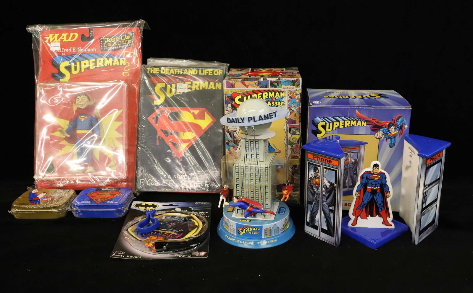Lot of Superman Vintage Items: Including: Telephone Booth S&P, Carousel, Whitman's Chocolate Tins, Batman Party Pouch, Superman Book and MAD Superman. PLEASE READ CAREFULLY - ITEMS MUST BE PAID FOR THROUGH LIVE AUCTIONEERS OR WITH 