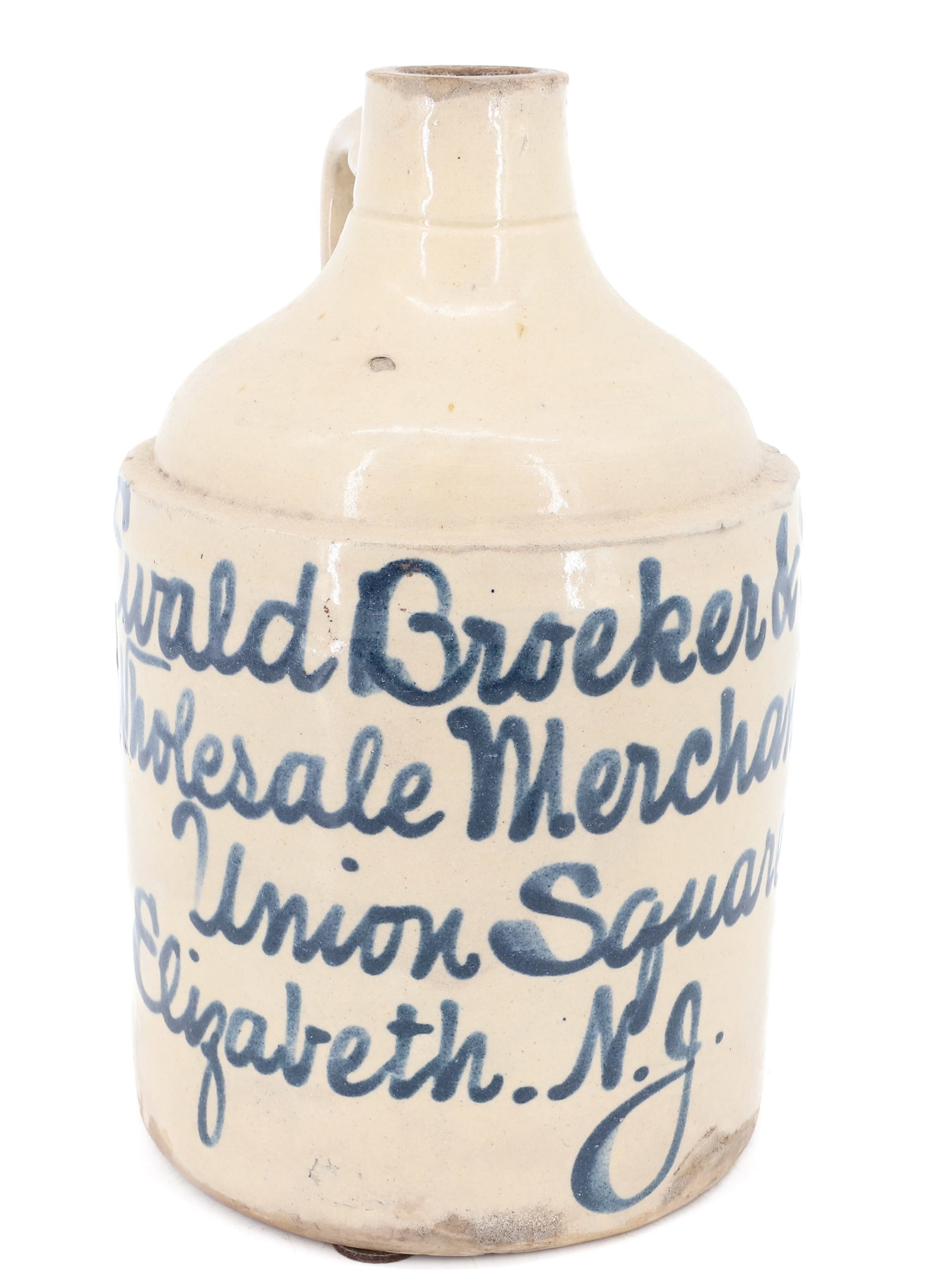 ELIZABETH, NJ BLUE SCRIPT ADVERTISING JUG: STONEWARE JUG MRKD. " EWALD BROEKER & CO., WHOLESALE MERCHANTS, UNION SQUARE, ELIZABETH N.J." 9 3/8" H. PLEASE READ CAREFULLY - ITEMS MUST BE PAID FOR THROUGH LIVE AUCTIONEERS OR WITH CASH OR CHECK IN