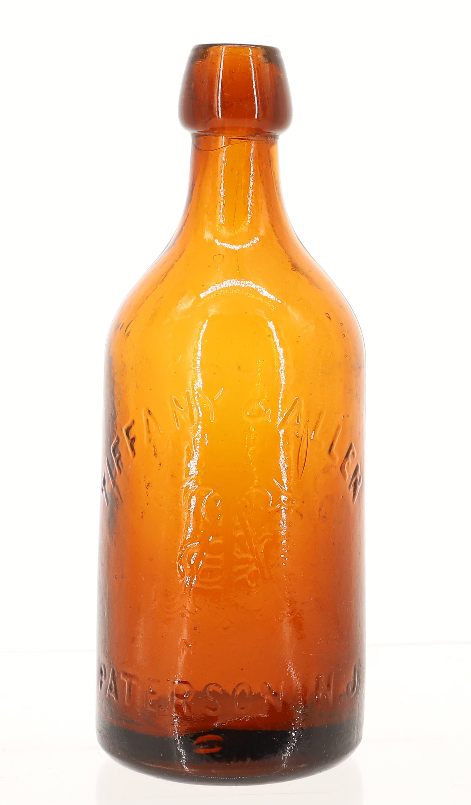 TIFFANY & ALLEN, PATERSON N.J. BOTTLE: EMBOSSED AMBER. MRKD. "DO NOT STEAL THIS BOTTLE ON BACK". 7 3/4" H. PLEASE READ CAREFULLY - ITEMS MUST BE PAID FOR THROUGH LIVE AUCTIONEERS OR WITH CASH OR CHECK IN PERSON - Terms for Purchasing and