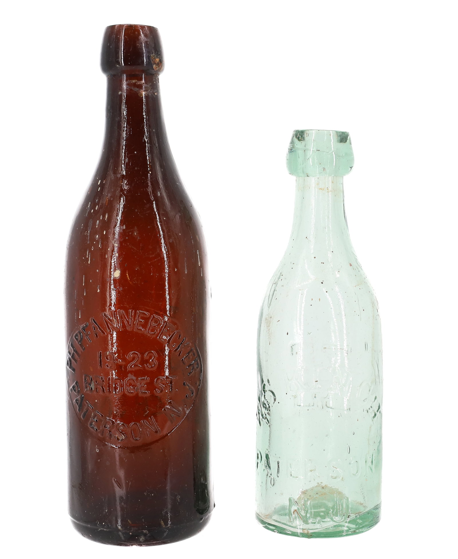 (2) PATERSON, N.J. BOTTLES: INCLUDING: W.S. KINCH IN LIGHT GREEN, EMBOSSED "K" ON BACK. 7 1/2" H. WITH, AMBER "P.H. PFANNEBECKER, 19-23 BRIDGE ST." 9 1/4" H. PLEASE READ CAREFULLY - ITEMS MUST BE PAID FOR THROUGH LIVE