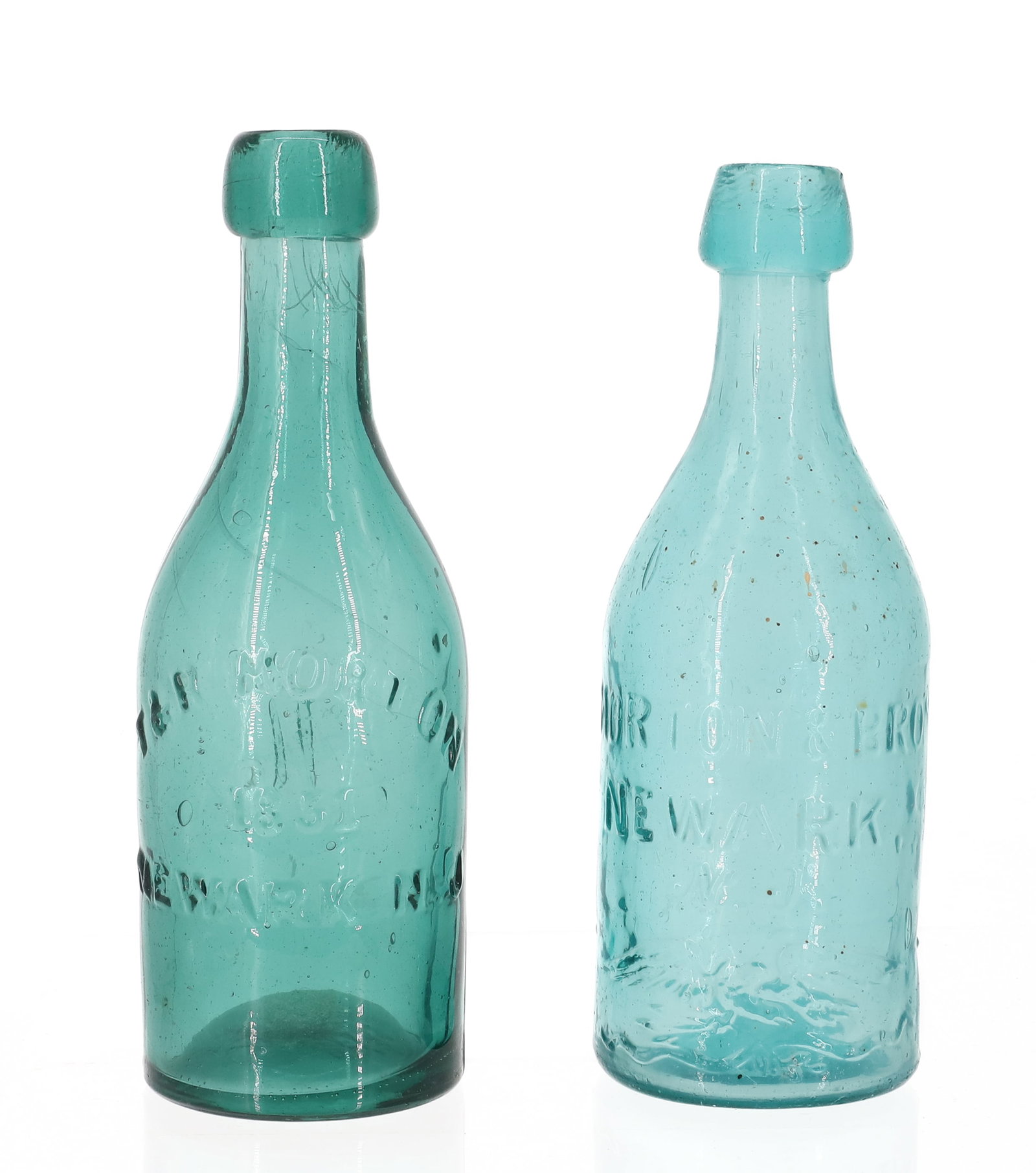 (2) NEWARK, N.J. "MORTON" BOTTLES: INCLUDING: AQUA "MORTON & BRO, NEWARK, N.J." WITH EMBOSSED EAGLE. 7 1/4" H. WITH, GREEN "T&R MORTON, 1851" (EMBOSSED CURSIVE "M" ON BACK". 7 1/2" H. PLEASE READ CAREFULLY - ITEMS MUST BE PAID FOR