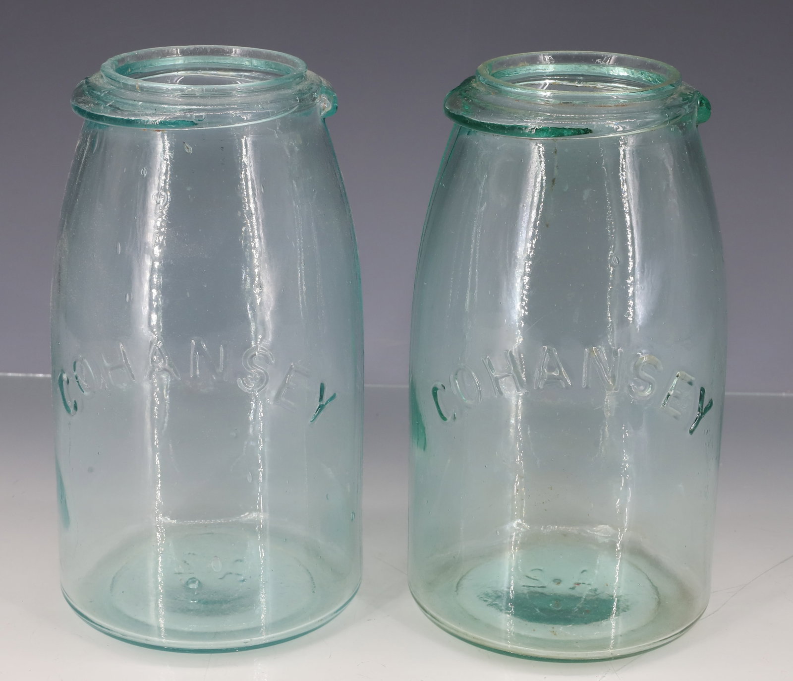 (2) COHANSEY FRUIT JARS: LIGHT AQUA. MRKD. A2 ON BOTTOMS. 6 3/4" H. PLEASE READ CAREFULLY - ITEMS MUST BE PAID FOR THROUGH LIVE AUCTIONEERS OR WITH CASH OR CHECK IN PERSON - Terms for Purchasing and Shipping of Auction