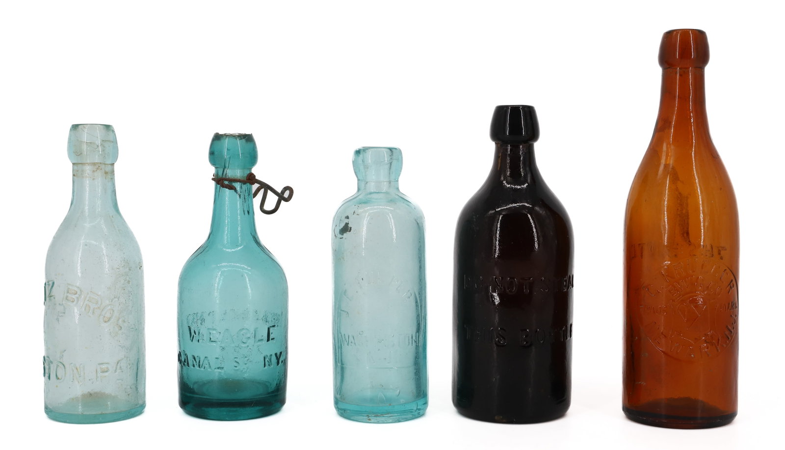 LOT OF ANTIQUE BOTTLES: (5) INCLUDING: AQUA "SEITZ BROS. EASTON". TEAL GREEN "W. EAGLE, CANAL ST. NY, PHILADELPHIA PORTER 1860" (ROUGHNESS TO TOP EDGE) 6 7/8" H. J.E. FULPER / WASHINGTON, NJ (BRUISE/CHIP AT TOP). AMBER "C.