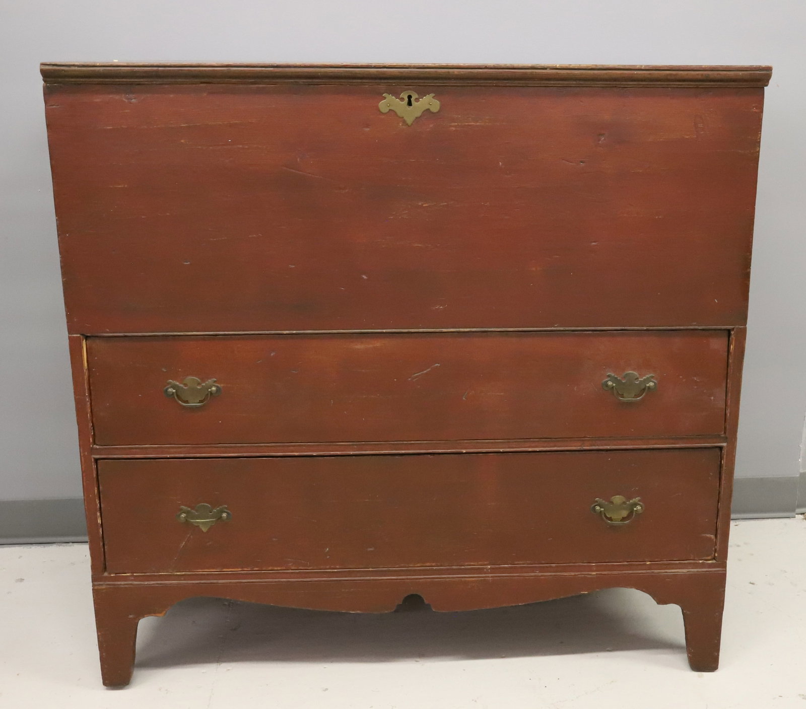 RED PAINTED BLANKET CHEST: CHEST OVER (2) DRAWERS, BRASS HARDWARE, WITH FRONT CUTOUTS - 38 1/2" X 39 1/2" X 18 1/2" PLEASE READ CAREFULLY - ITEMS MUST BE PAID FOR THROUGH LIVE AUCTIONEERS OR WITH CASH OR CHECK IN PERSON -