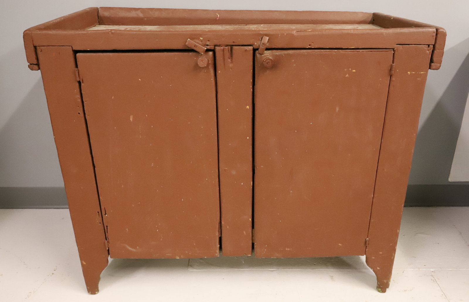 19TH CENTURY RED PAINTED DRY SINK: OLD RED OVER LAYERS OF GREEN, WELL TOP OVER 2 DOORS WITH INTERIOR SHELVES - 32" X 40" X 20" PLEASE READ CAREFULLY - ITEMS MUST BE PAID FOR THROUGH LIVE AUCTIONEERS OR WITH CASH OR CHECK IN PERSON -
