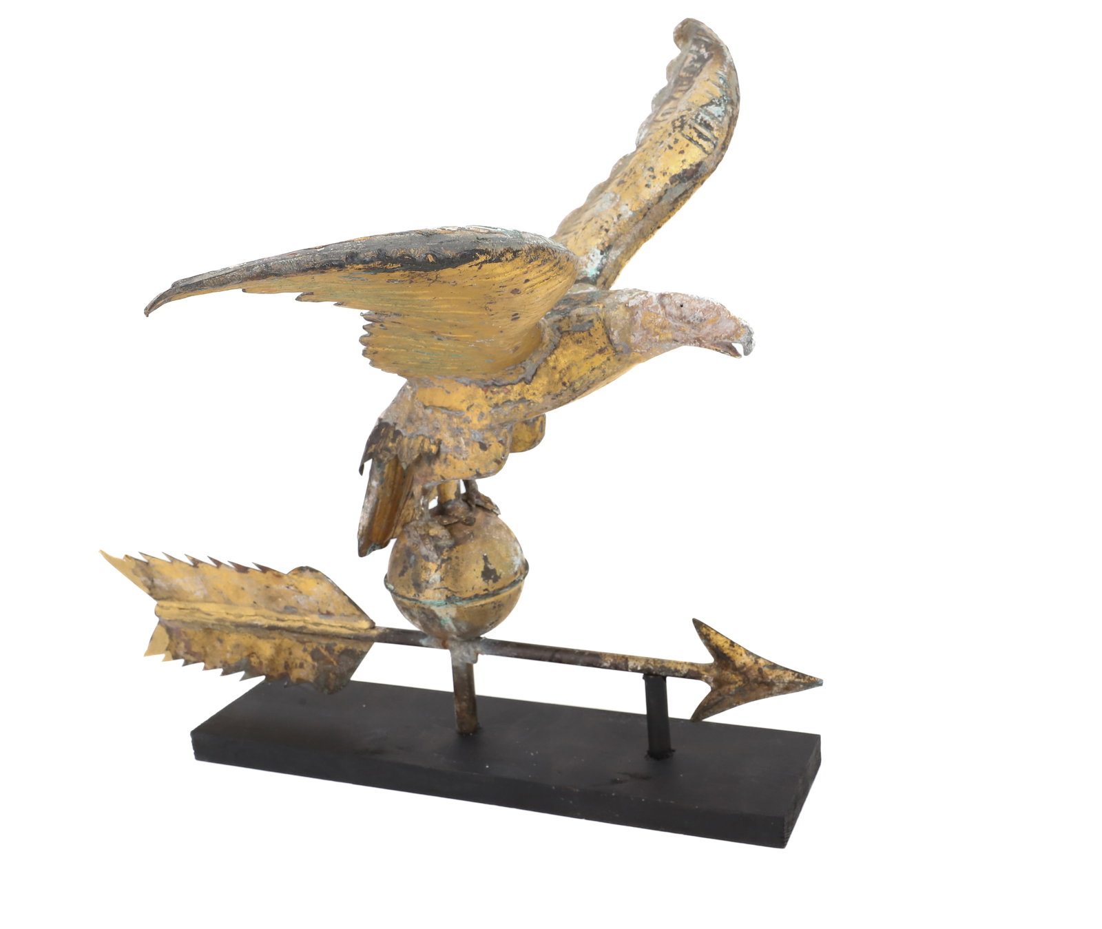 GILT COPPER EAGLE WEATHERVANE: HOLLOW-BODY EAGLE WITH OUTSTRETCHED WINGS PERCHED ON BALL / ARROW. CONTEMPORARY DISPLAY BASE. 16" X 18" X 17 3/4". PLEASE READ CAREFULLY - ITEMS MUST BE PAID FOR THROUGH LIVE AUCTIONEERS OR WITH CASH