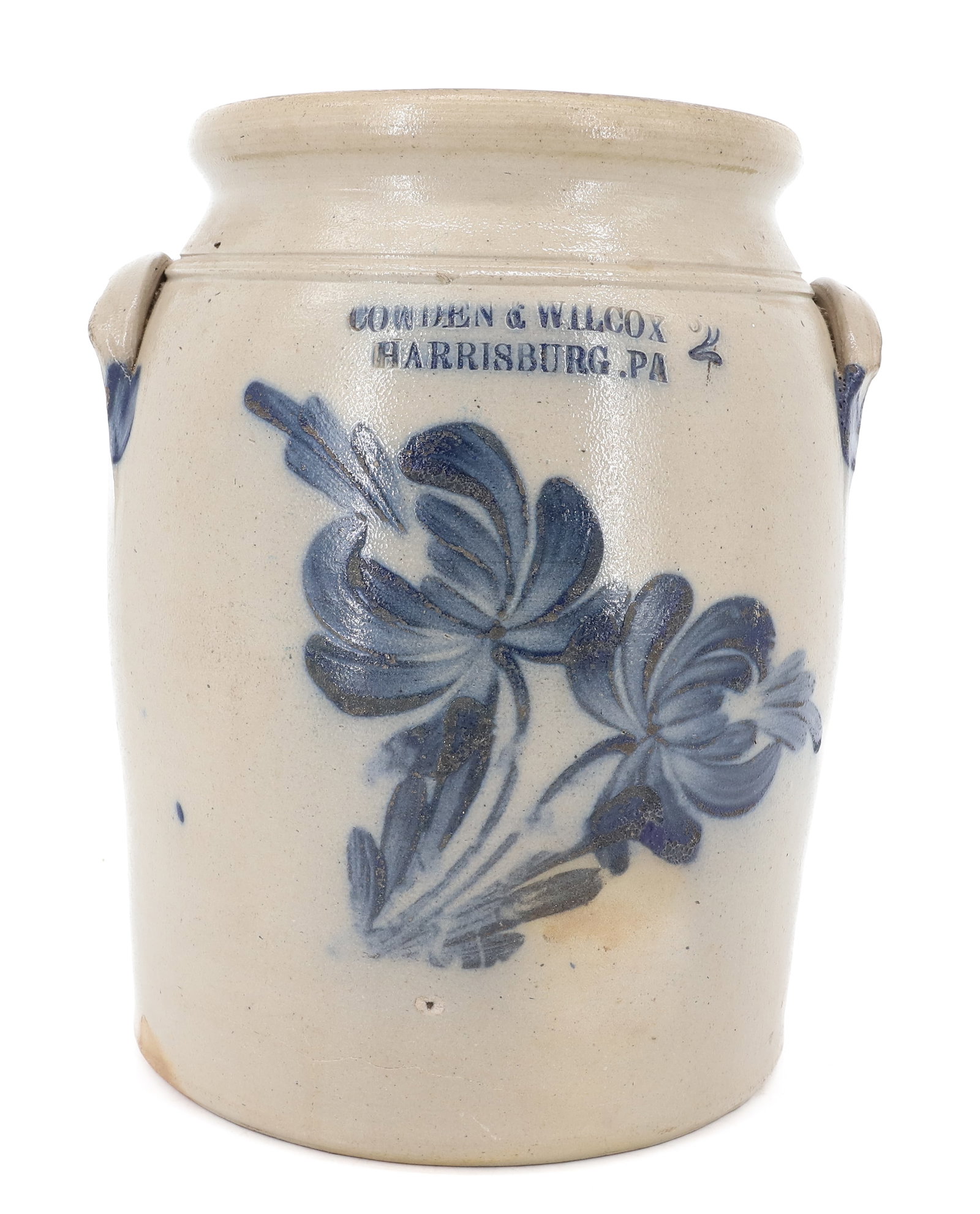 BLUE DECORATED STONEWARE CROCK: BLUE FLORAL TWO-GALLON CROCK BY "COWDEN & WILCOX, HARRISBURG, PA". LUG HANDLES ON SIDES. 11 1/2" H. PLEASE READ CAREFULLY - ITEMS MUST BE PAID FOR THROUGH LIVE AUCTIONEERS OR WITH CASH OR CHECK IN
