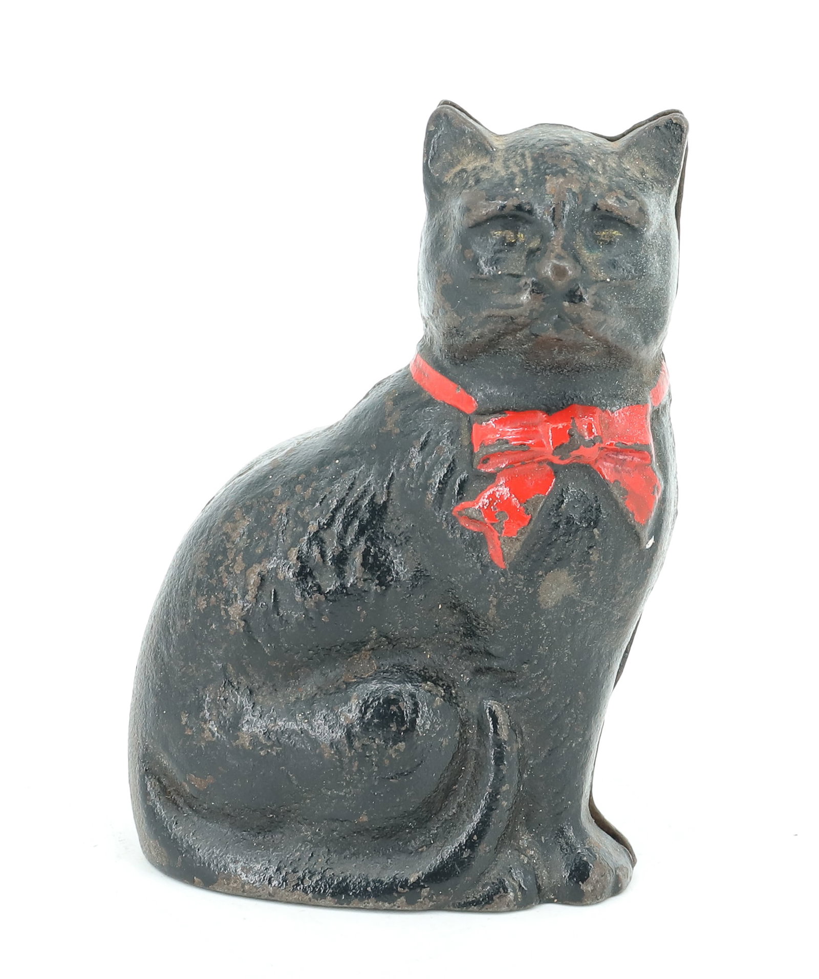 CAST IRON CAT BANK: PAINTED SEATED CAT STILL BANK. BLACK WITH RED BOW. 4 1/4" H. PLEASE READ CAREFULLY - ITEMS MUST BE PAID FOR THROUGH LIVE AUCTIONEERS OR WITH CASH OR CHECK IN PERSON - Terms for Purchasing and Shipping