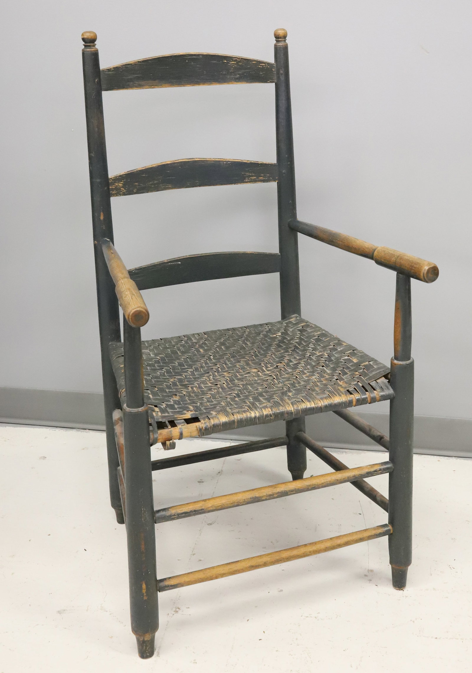 19TH CENTURY PAINTED LADDER BACK CHAIR: ARMCHAIR IN BLUE GREY PAINT, WOVEN SEAT - 38" X 19 1/2" X 15" PLEASE READ CAREFULLY - ITEMS MUST BE PAID FOR THROUGH LIVE AUCTIONEERS OR WITH CASH OR CHECK IN PERSON - Terms for Purchasing and