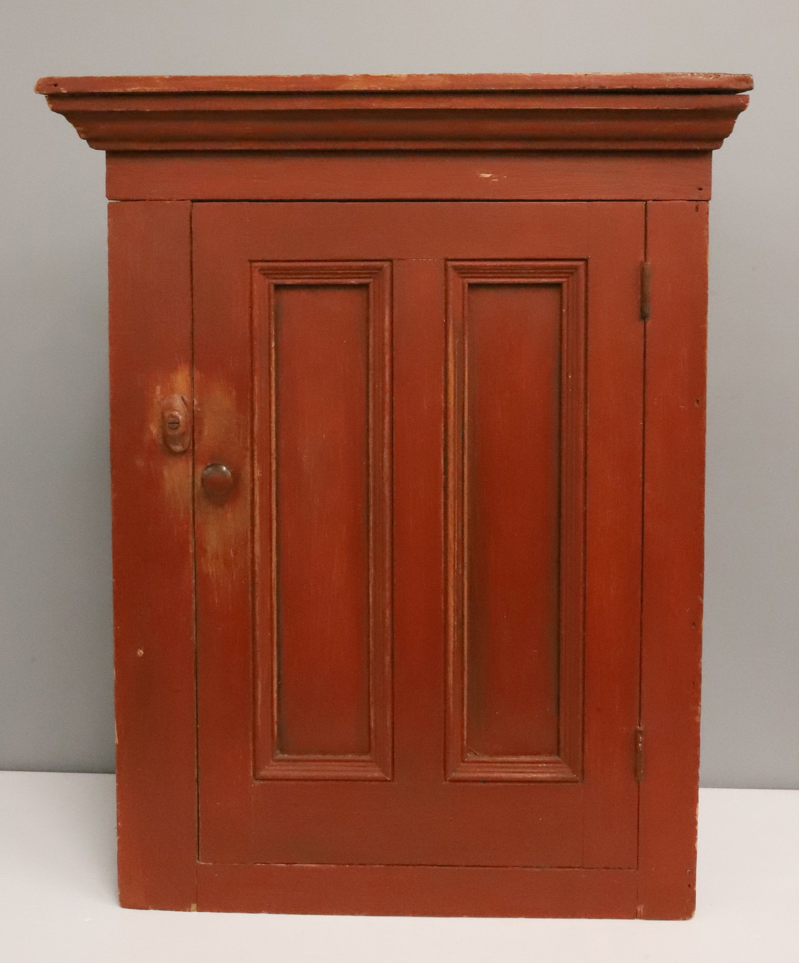 PAINTED COUNTRY CORNER CUPBOARD: HANGING CUPBOARD WITH PANELED DOOR AND PAINTED INTERIOR - 32 1/2" X 26" X 12 1/2" PLEASE READ CAREFULLY - ITEMS MUST BE PAID FOR THROUGH LIVE AUCTIONEERS OR WITH CASH OR CHECK IN PERSON - Terms for Pu