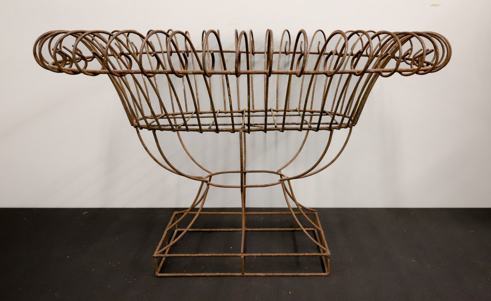 WROUGHT IRON PLANT STAND: RECTANGULAR BASE WITH OVAL TOP. 18 3/4" X 30" X 21 1/2". PLEASE READ CAREFULLY - ITEMS MUST BE PAID FOR THROUGH LIVE AUCTIONEERS OR WITH CASH OR CHECK IN PERSON - Terms for Purchasing and Shipping of