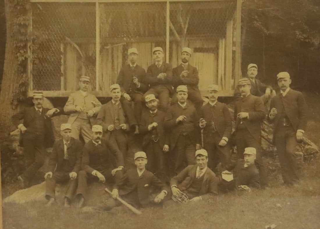 EARLY FRAMED BASEBALL TEAM PHOTOGRAPH: 19TH/20TH C. PHOTOGRAPH WITH TEA IN SUITS WITH CAPS. BASEBALL BAT, BALL AND MASK IN FRONT. SIGHT VIEW IS 6" X 8". PLEASE READ CAREFULLY - ITEMS MUST BE PAID FOR THROUGH LIVE AUCTIONEERS OR WITH CASH