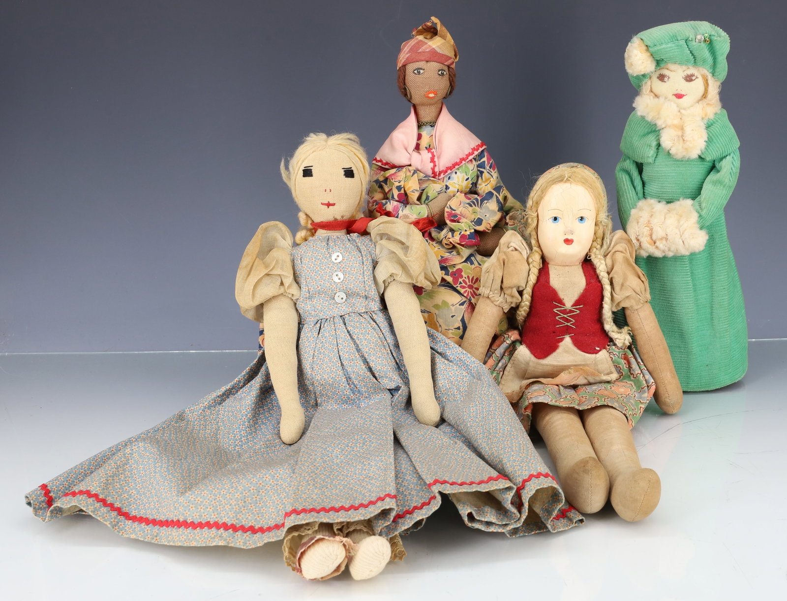 LOT OF (4) HANDMADE DOLLS: THREE CLOTH WITH SEWN FACES AND ONE PAINTED COMPOSITION FACE. 8 3/4" TO 13 1/2" HEIGHTS. PLEASE READ CAREFULLY - ITEMS MUST BE PAID FOR THROUGH LIVE AUCTIONEERS OR WITH CASH OR CHECK IN PERSON -