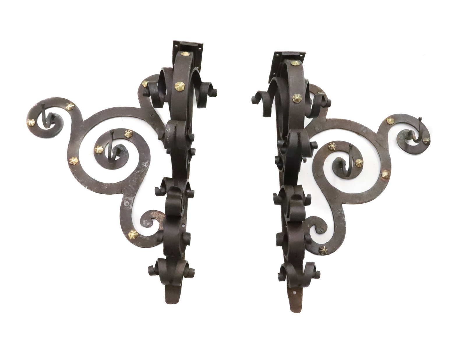 PAIR OF WROUGHT IRON BRACKETS W/ HOOKS: WROUGHT IRON WITH BRASS ACCENTS. TWO HOOKS ON EITHER SIDE. 21" X 16" X 8". BRACKETS ON TOPS TO HOLD SHELF. PLEASE READ CAREFULLY - ITEMS MUST BE PAID FOR THROUGH LIVE AUCTIONEERS OR WITH CASH OR