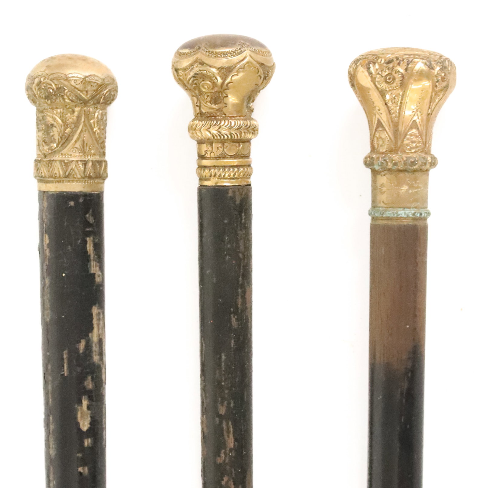 (3) GOLD CAPPED WALKING STICKS: FANCY ART NOUVEAU STYLES. ONE MONOGRAMMED ON TOP. ALL UNMARKED. 31" TO 33 1/2" LENGTHS. PLEASE READ CAREFULLY - ITEMS MUST BE PAID FOR THROUGH LIVE AUCTIONEERS OR WITH CASH OR CHECK IN PERSON - Terms