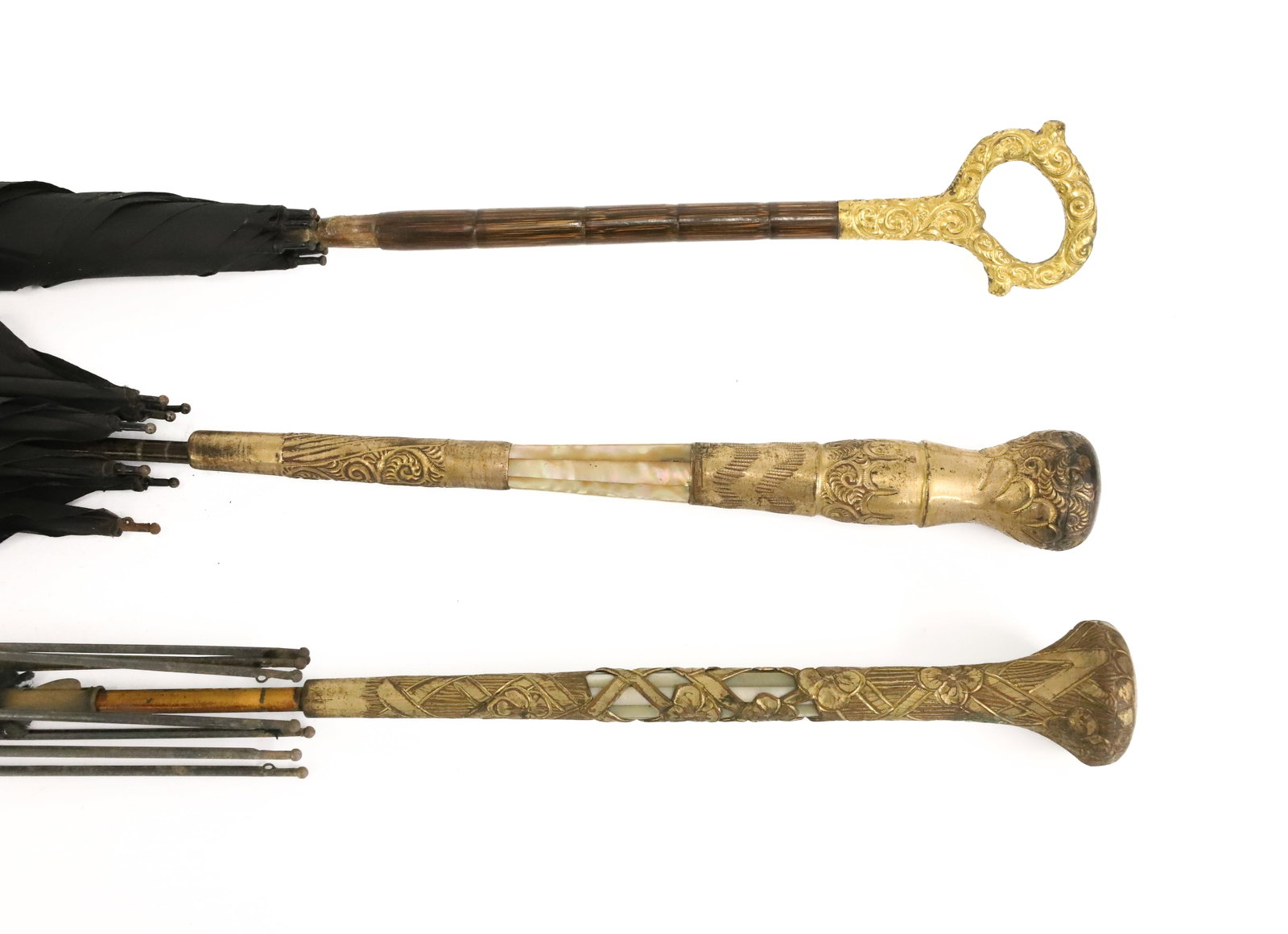 LOT OF ANTIQUE UMBRELLAS / PARASOLS: FANCY BRASS / MOTHER-OF-PEARL / ABALONE DECORATED HANDLES. LONGEST 40" L. PLEASE READ CAREFULLY - ITEMS MUST BE PAID FOR THROUGH LIVE AUCTIONEERS OR WITH CASH OR CHECK IN PERSON - Terms for