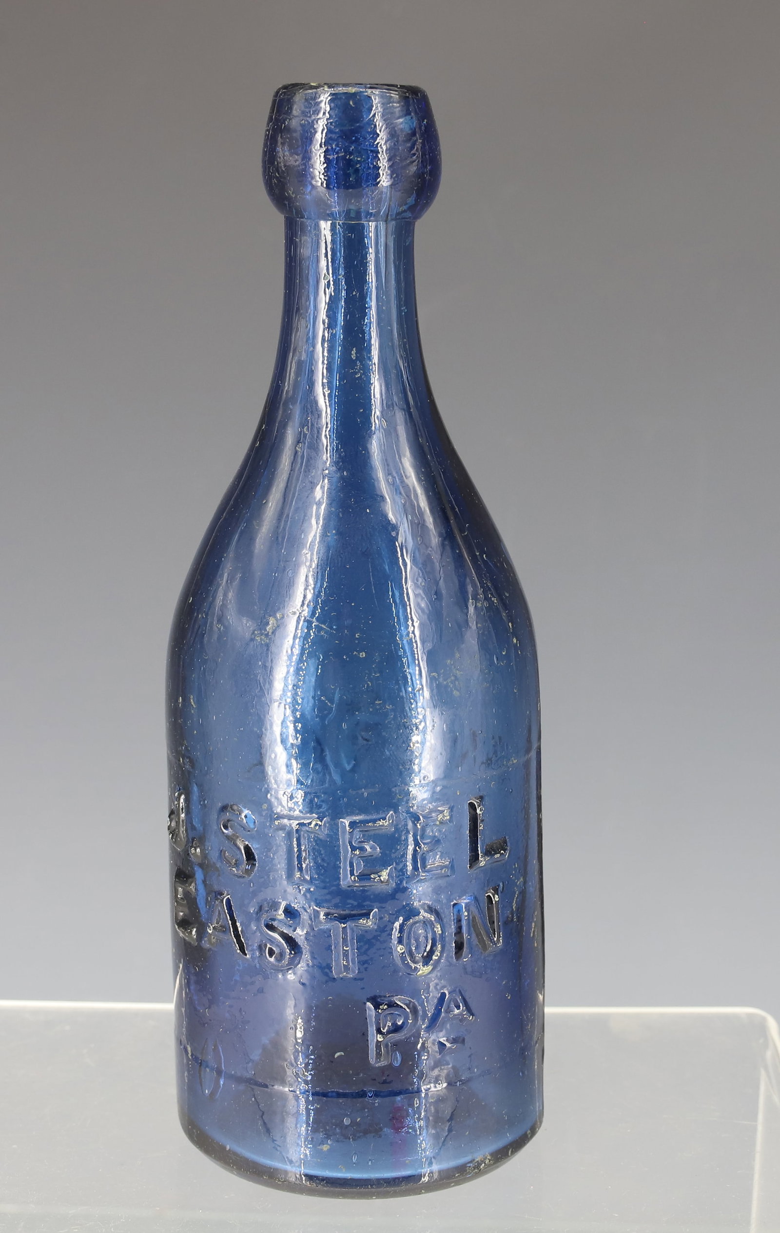 J. STEEL, EASTON PA MINERAL WATER BOTTLE: BLUE BOTTLE 7 1/4" H. IRON PONTIL. PLEASE READ CAREFULLY - ITEMS MUST BE PAID FOR THROUGH LIVE AUCTIONEERS OR WITH CASH OR CHECK IN PERSON - Terms for Purchasing and Shipping of Auction Items. Please