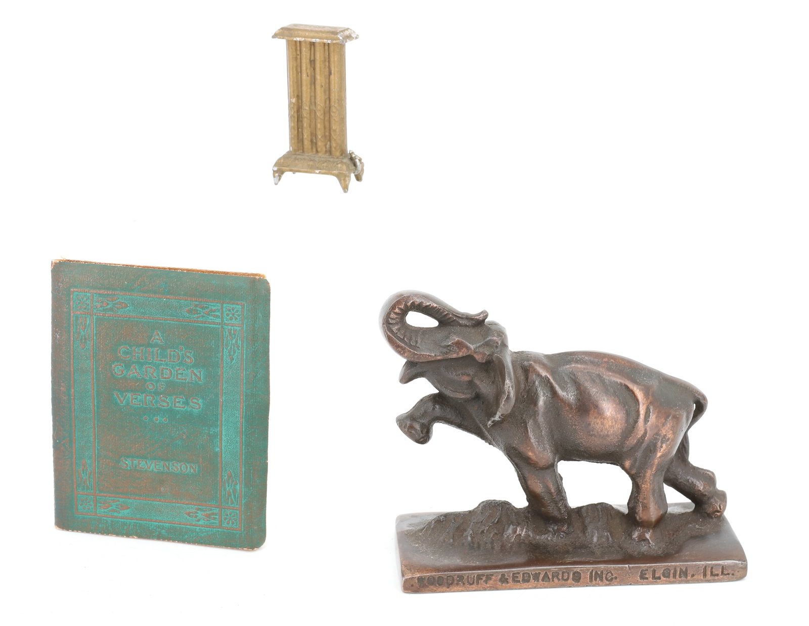 CAST IRON ADVERTISER, MINIATURE AND BOOK: JAPANNED ELEPHANT ADVERTISING WOODRUFF & EDWARDS (ELGIN, ILL) "GREY IRON & SEMI-STEEL CASTINGS" 5" L. PAINTED METAL HEATER 2 1/8" H. AND "A CHILD'S GARDEN OF VERSES" ROBERT LOUIS STEVENSON. PLEASE