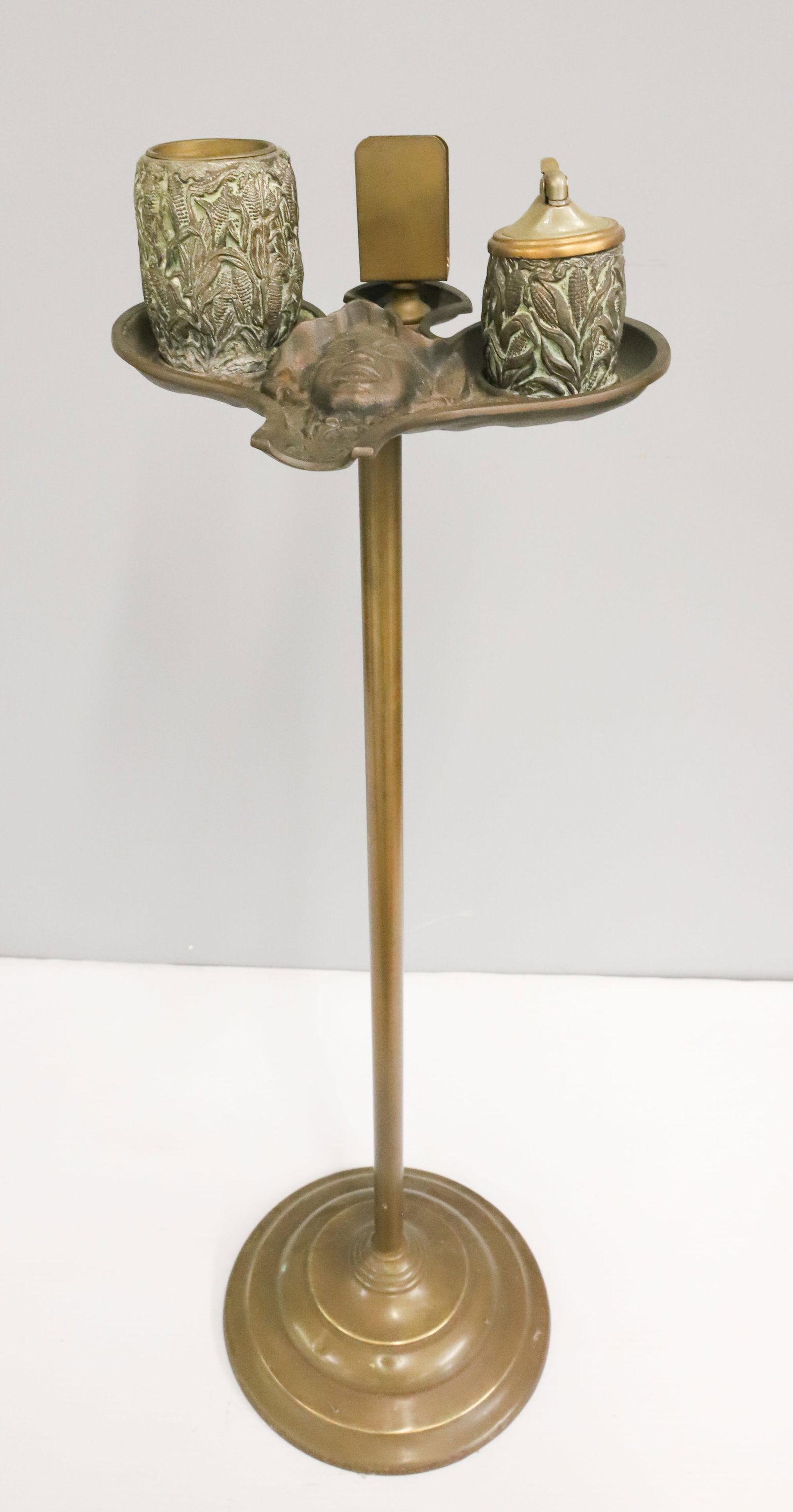CAST IRON AND BRASS BLACK AMERICANA SMOKING STAND: JOHNNY GRIFFIN SMOKING STAND. 30" X 9". PLEASE READ CAREFULLY - ITEMS MUST BE PAID FOR THROUGH LIVE AUCTIONEERS OR WITH CASH OR CHECK IN PERSON - Terms for Purchasing and Shipping of Auction Items.