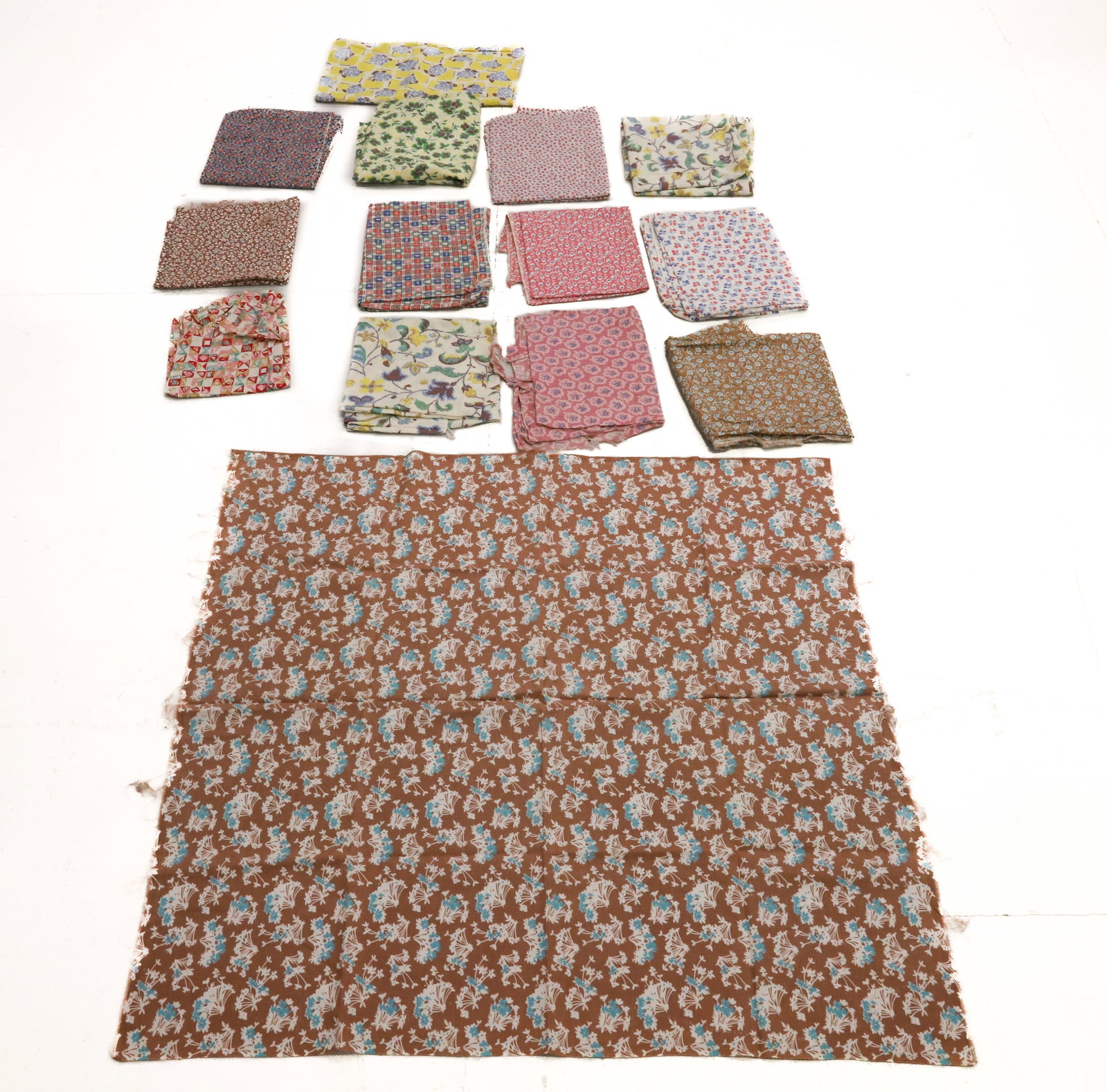 LOT OF VINTAGE FEEDSACK PRINTED MATERIAL: (14) VARIOUS FEED BAGS WITH MOSTLY FLORAL PRINT. PLEASE READ CAREFULLY - ITEMS MUST BE PAID FOR THROUGH LIVE AUCTIONEERS OR WITH CASH OR CHECK IN PERSON - Terms for Purchasing and Shipping of Auction 