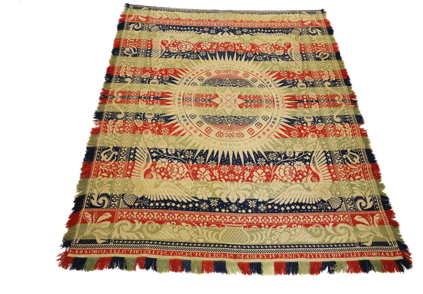 19TH C. LEBANON COUNTY, PA COVERLET: RED/CREAM/BLUE/GREEN COVERLET WITH LARGER CENTRAL STAR COMPASS WITH EAGLE/SHIELD IN EACH CORNER. SGND. IN BORDER "MADE BY WM. NEY, MYERSTOWN, LEBANON, CO., PA" LYRE/CORNUCOPIA/URN BORDER. FRINGE EDGE.