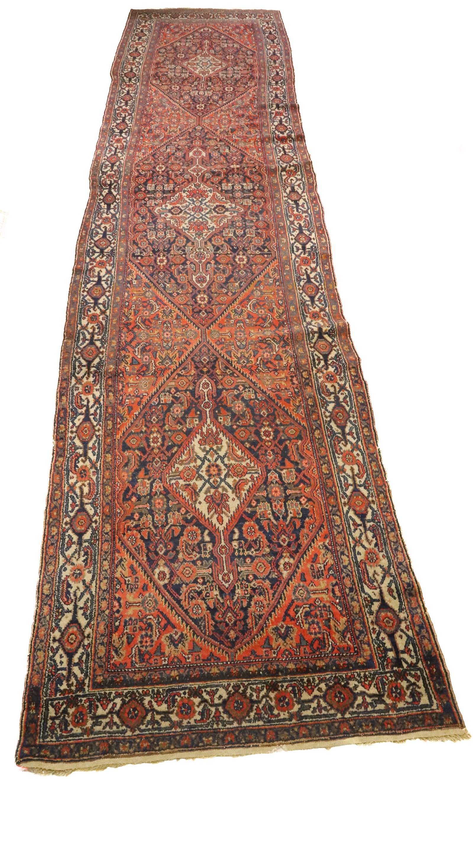 ANTIQUE ORIENTAL RUNNER, RUG: ORANGE/RED WITH NAVY, GREEN, TAN, CREAM. FLORAL PATTERNS. MULTIPLE BORDERS. 15' 9" X 42 1/2". PLEASE READ CAREFULLY - ITEMS MUST BE PAID FOR THROUGH LIVE AUCTIONEERS OR WITH CASH OR CHECK IN PERSON -