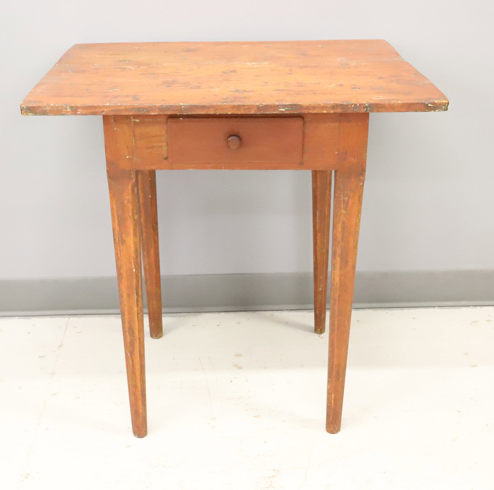 TAPERED LEG ONE DRAWER WORK TABLE: TWO-BOARD TOP OVER SINGLE DRAWER. RED WASH TO SURFACE. 26" X 26" X 21 1/4". PLEASE READ CAREFULLY - ITEMS MUST BE PAID FOR THROUGH LIVE AUCTIONEERS OR WITH CASH OR CHECK IN PERSON - Terms for